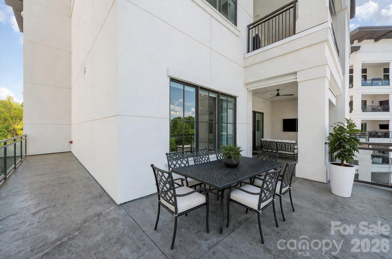 Virtually staged wrap around Lanai both uncovered and covered areas - 19329 Watermark Drive, Cornelius