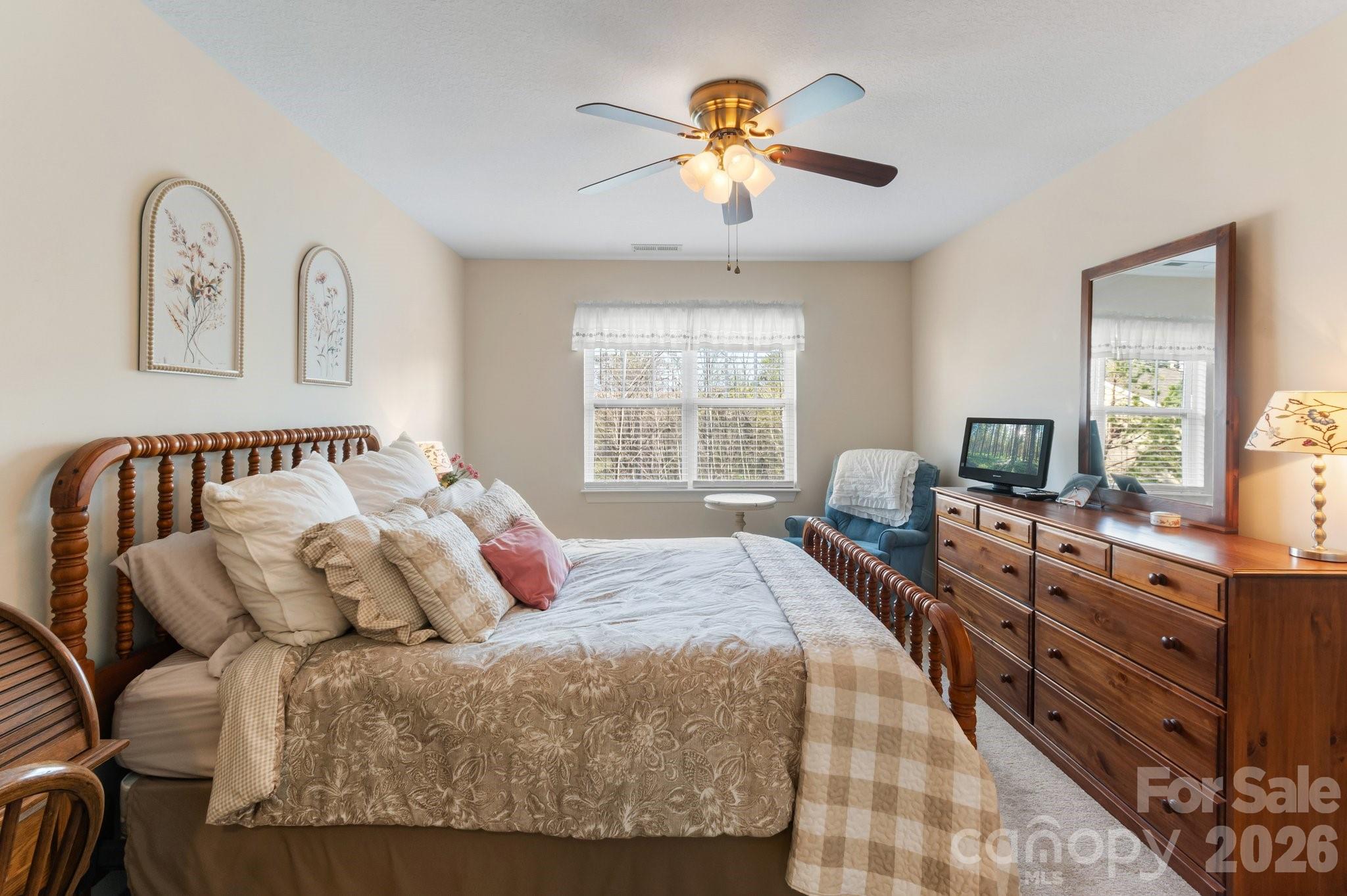 Primary bedroom looks over the wooded area in the back. Very private and serene setting. - 94 Foxden Drive, Fletcher