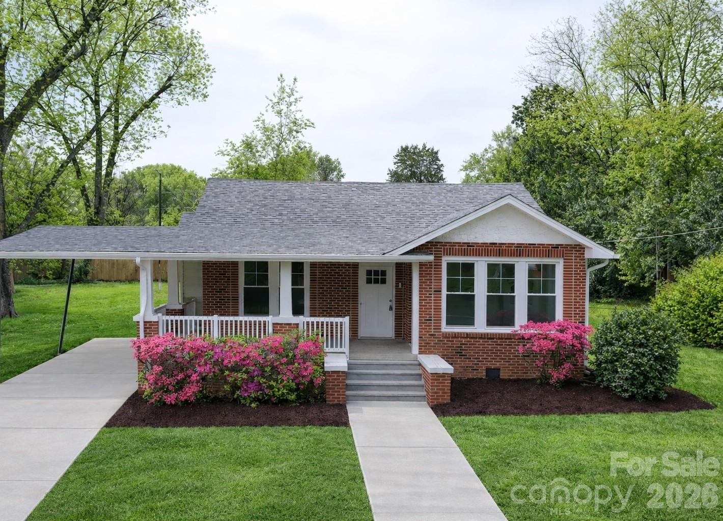 Virtually enhanced for brighter grass and walkways. - 307 W Washington Avenue, Bessemer City