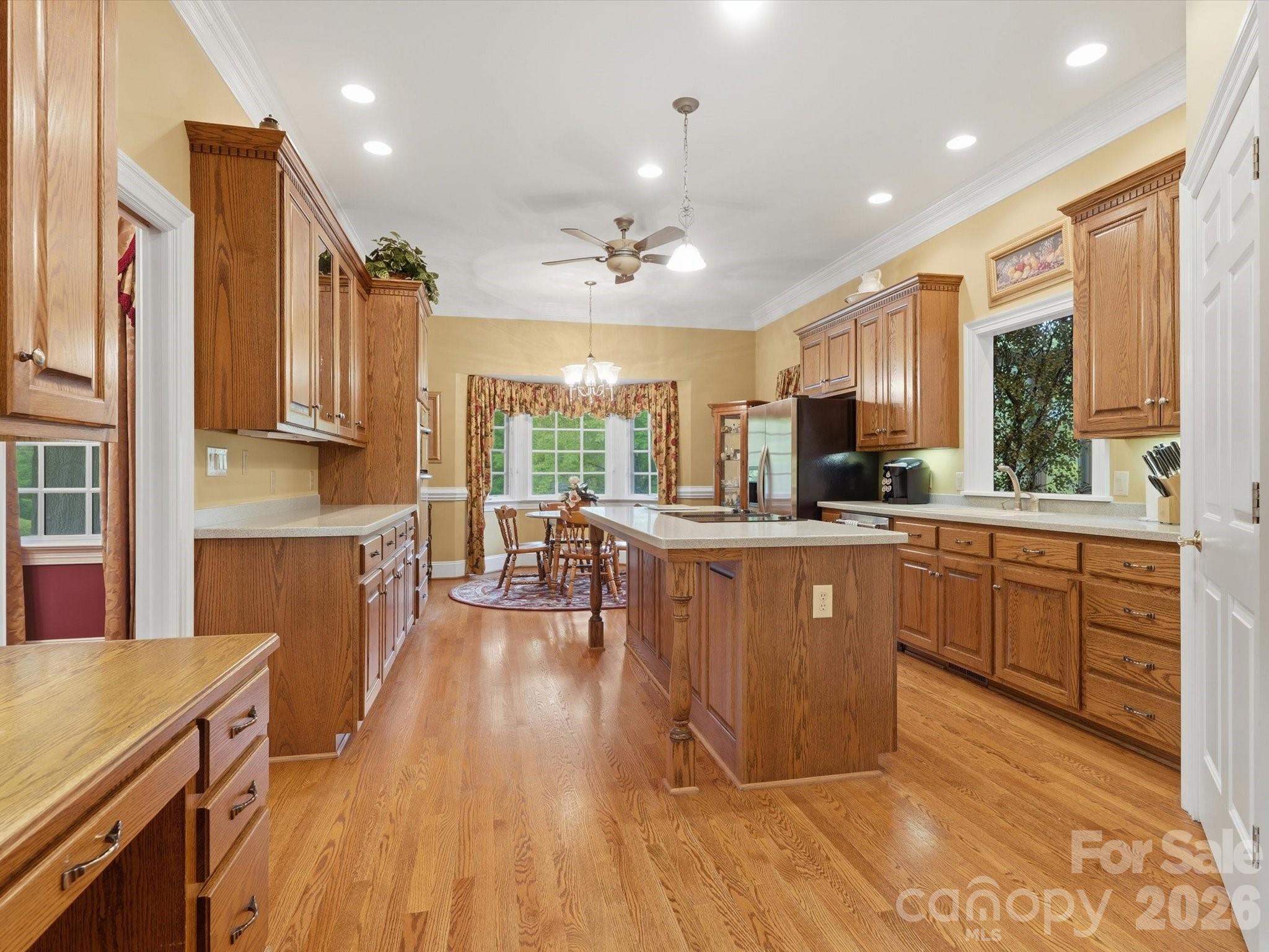 Kitchen with window views of the lake. Built in desk space. Island with room for bar stools/ breakfast bar area. - 1215 Rosa Drive, Monroe
