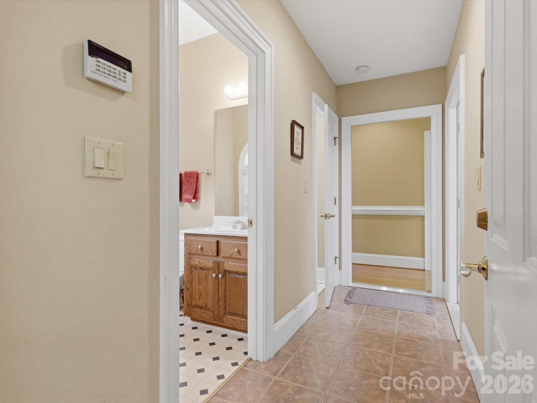 Entrance/ hallway to single garage space, double garage space, second half bathroom and large storage closet. - 1215 Rosa Drive, Monroe