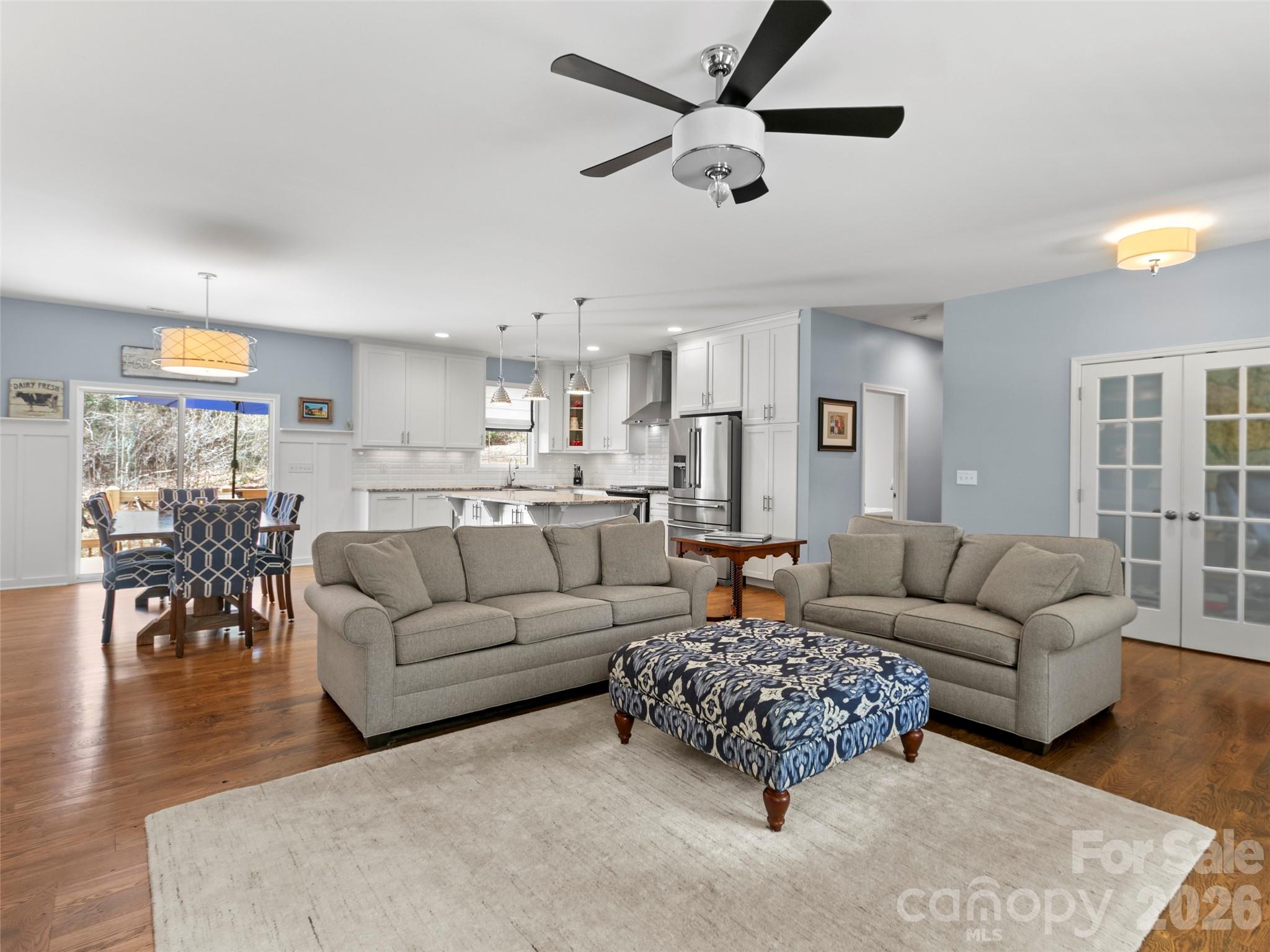 Expansive open-concept living area offering ample space for relaxing and entertaining, filled with natural light and designed for effortless flow throughout the main level - 290 Sweetwater Hills Drive, Hendersonville