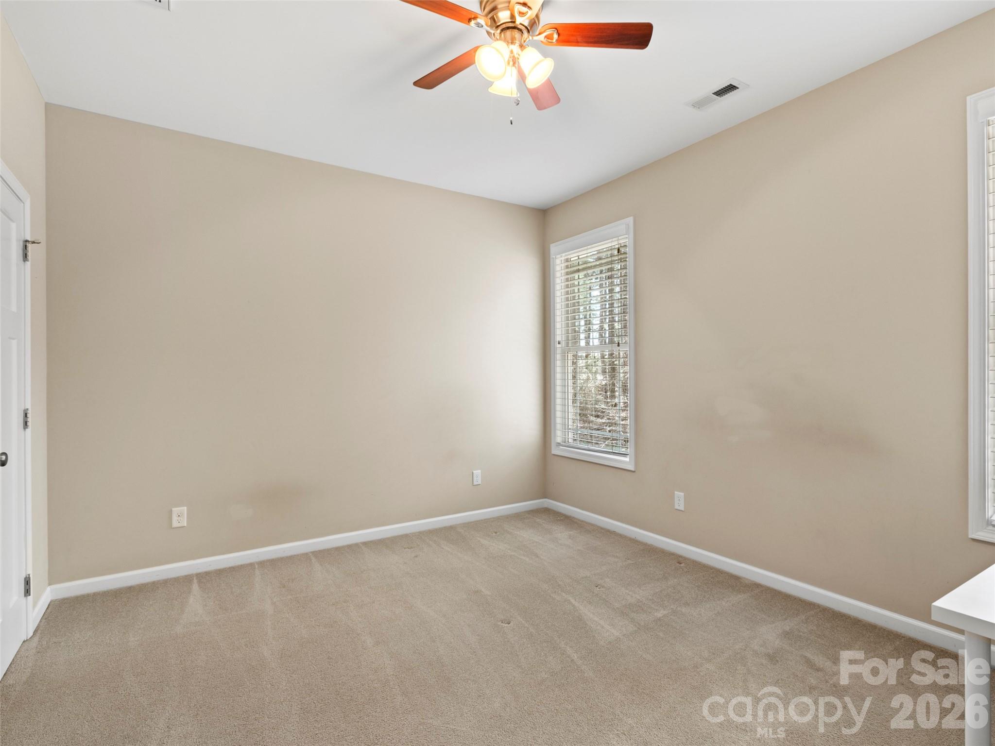 Well-appointed main-level bedroom offering generous closet storage and a full bath shared for everyday convenience - 290 Sweetwater Hills Drive, Hendersonville