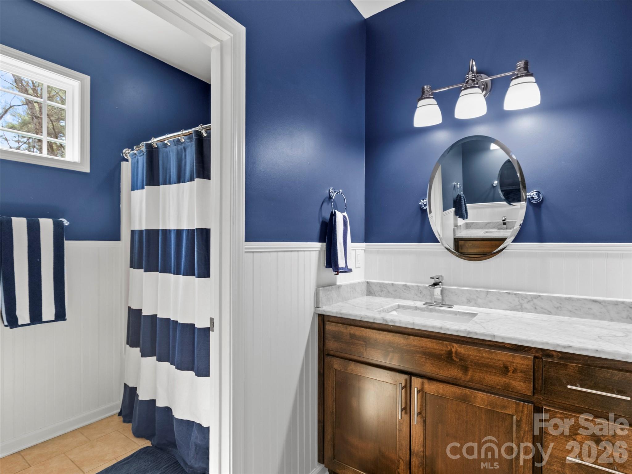 Well-appointed main-level bathroom providing easy access for guests or daily living needs - 290 Sweetwater Hills Drive, Hendersonville