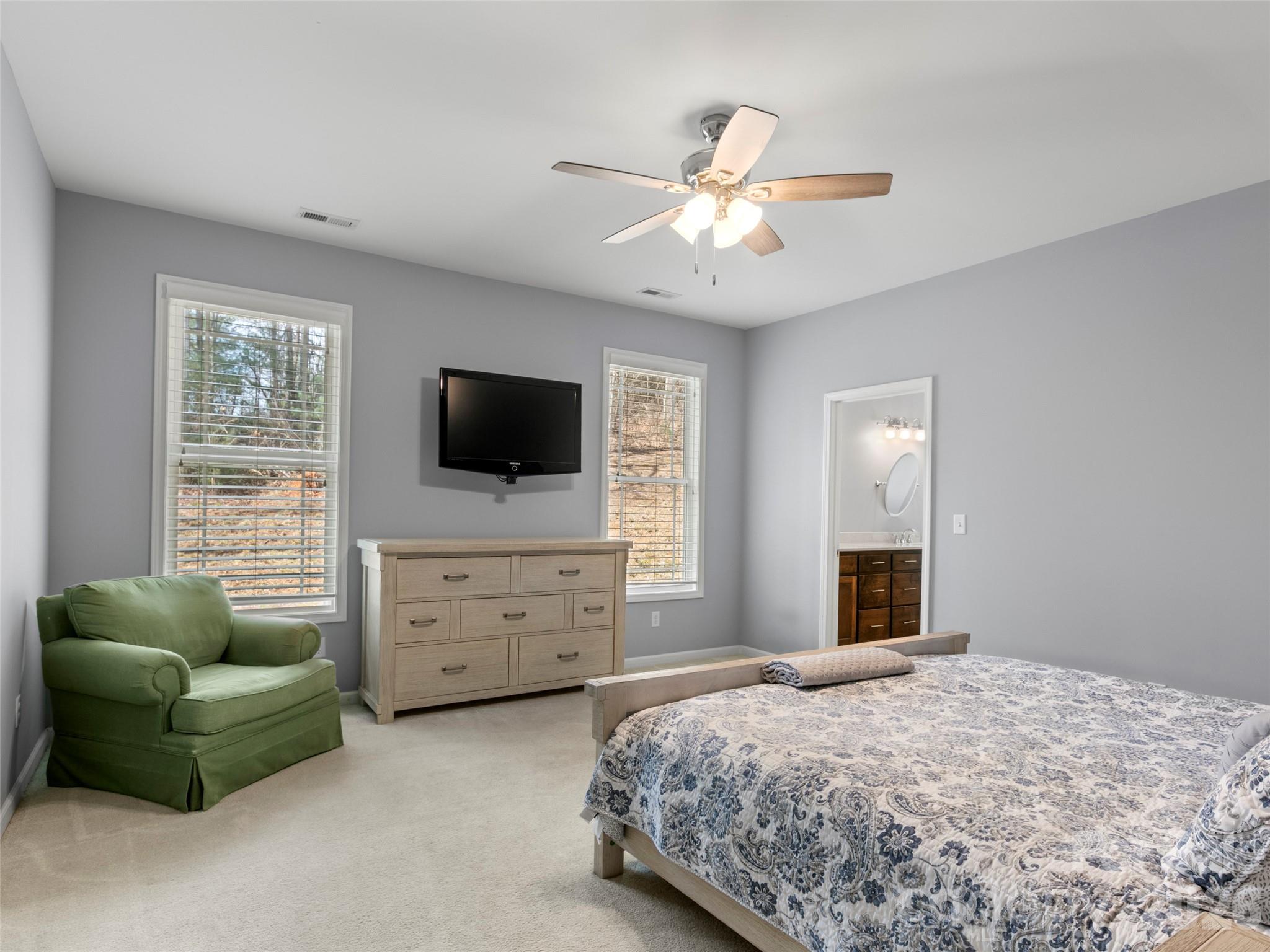 Elegant primary suite featuring generous proportions and a serene atmosphere designed for relaxation - 290 Sweetwater Hills Drive, Hendersonville