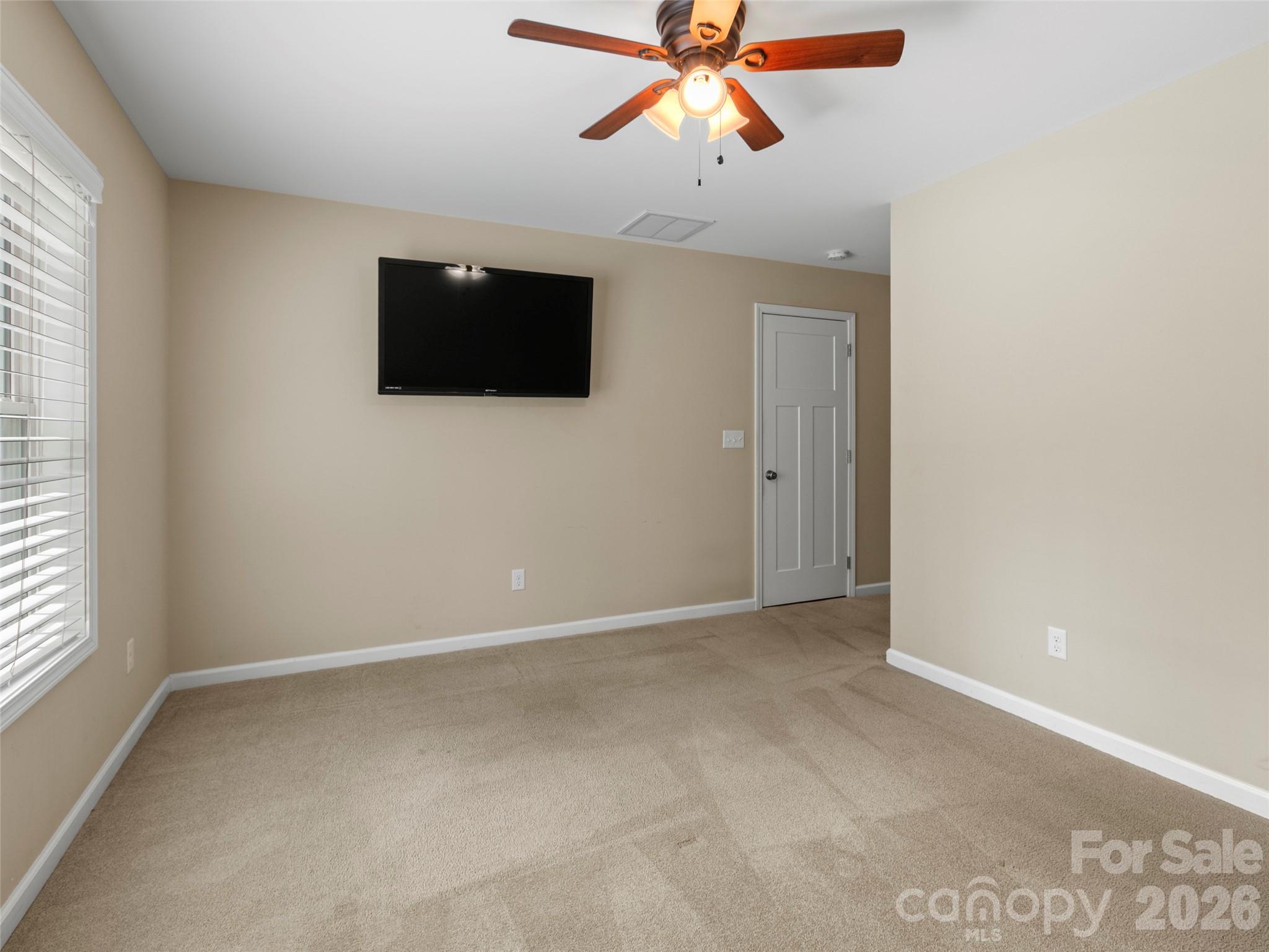 Well-appointed lower-level bedroom offering a private full bathroom and generous walk-in closet storage - 290 Sweetwater Hills Drive, Hendersonville