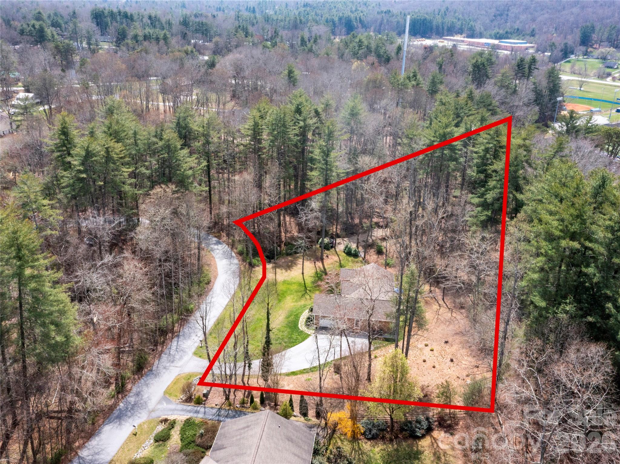 Protected Creekside Buffer Ensuring Lasting Privacy — A natural, preserved setting surrounding the entire 1.49-acre property, creating a truly private and secluded sanctuary. - 290 Sweetwater Hills Drive, Hendersonville