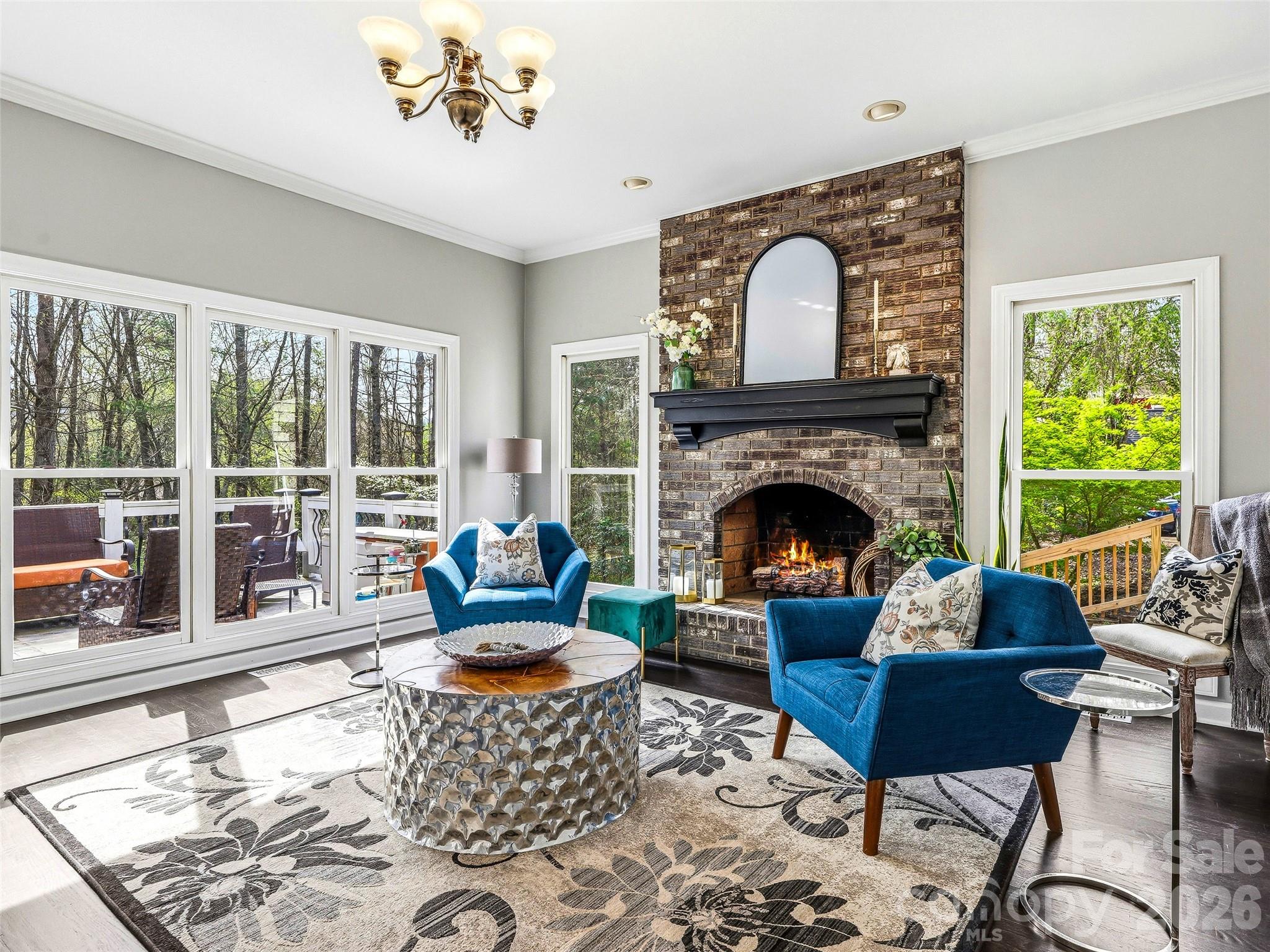 Family room with views of the back deck. - 32 Franklin Farm Road, Fletcher