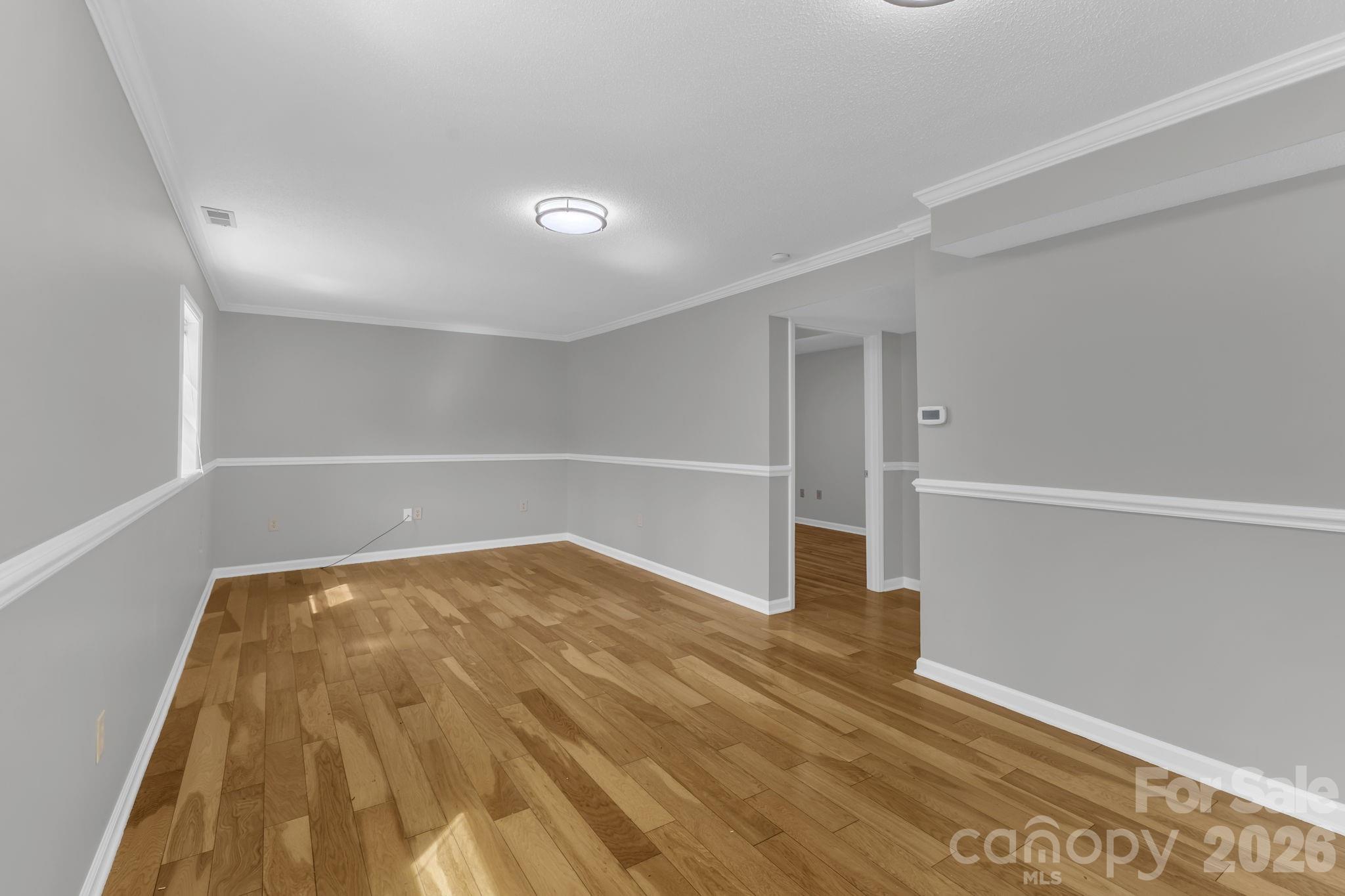 Family Room in Basement, hardwood floors - 147 Elkwood Road, Asheville