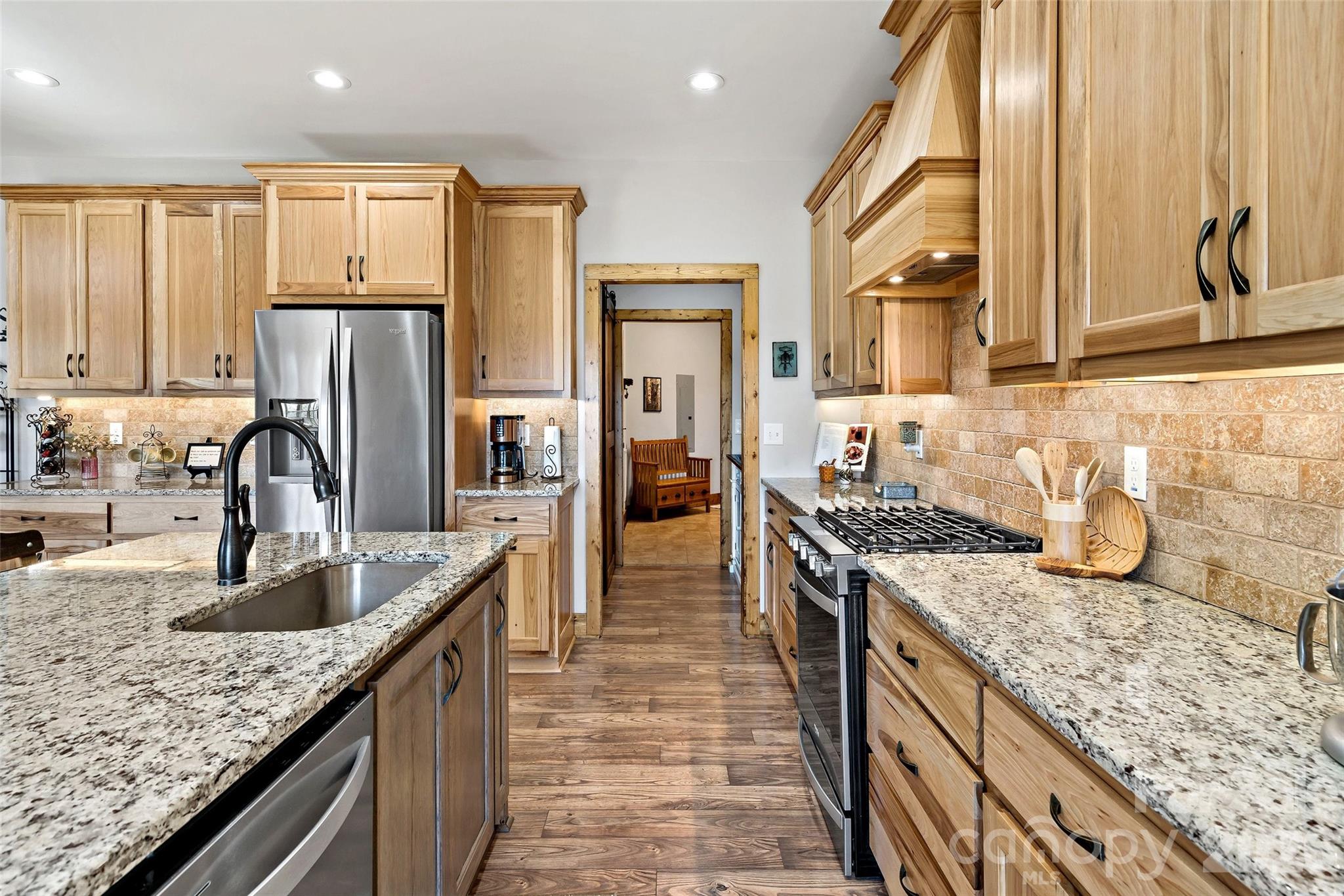 Kitchen sink and dishwasher on the island side - 207 Lake Crest Drive, Nebo