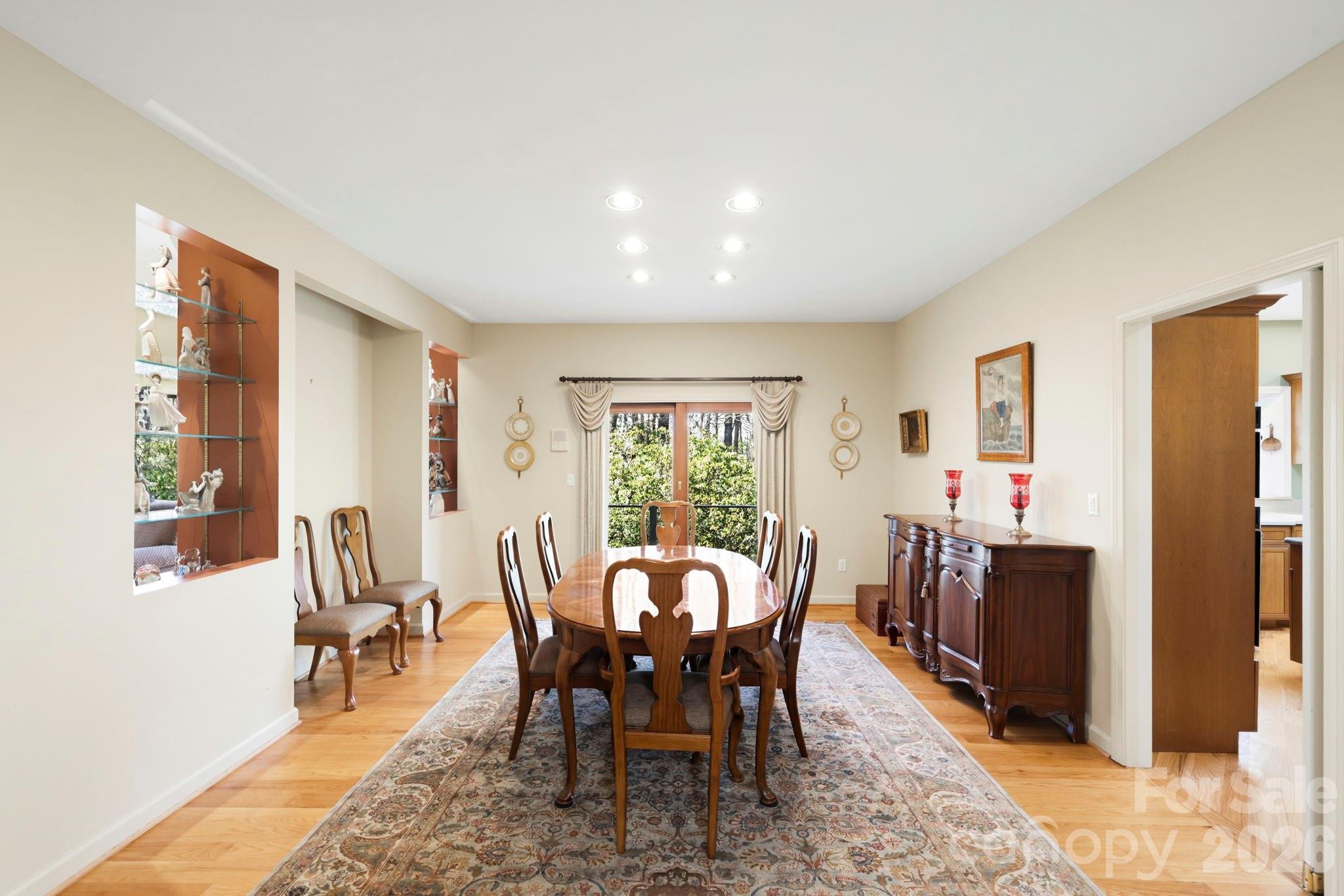 Open dining room includes glass shelving looking into living room - 100 Elmridge Drive, Flat Rock