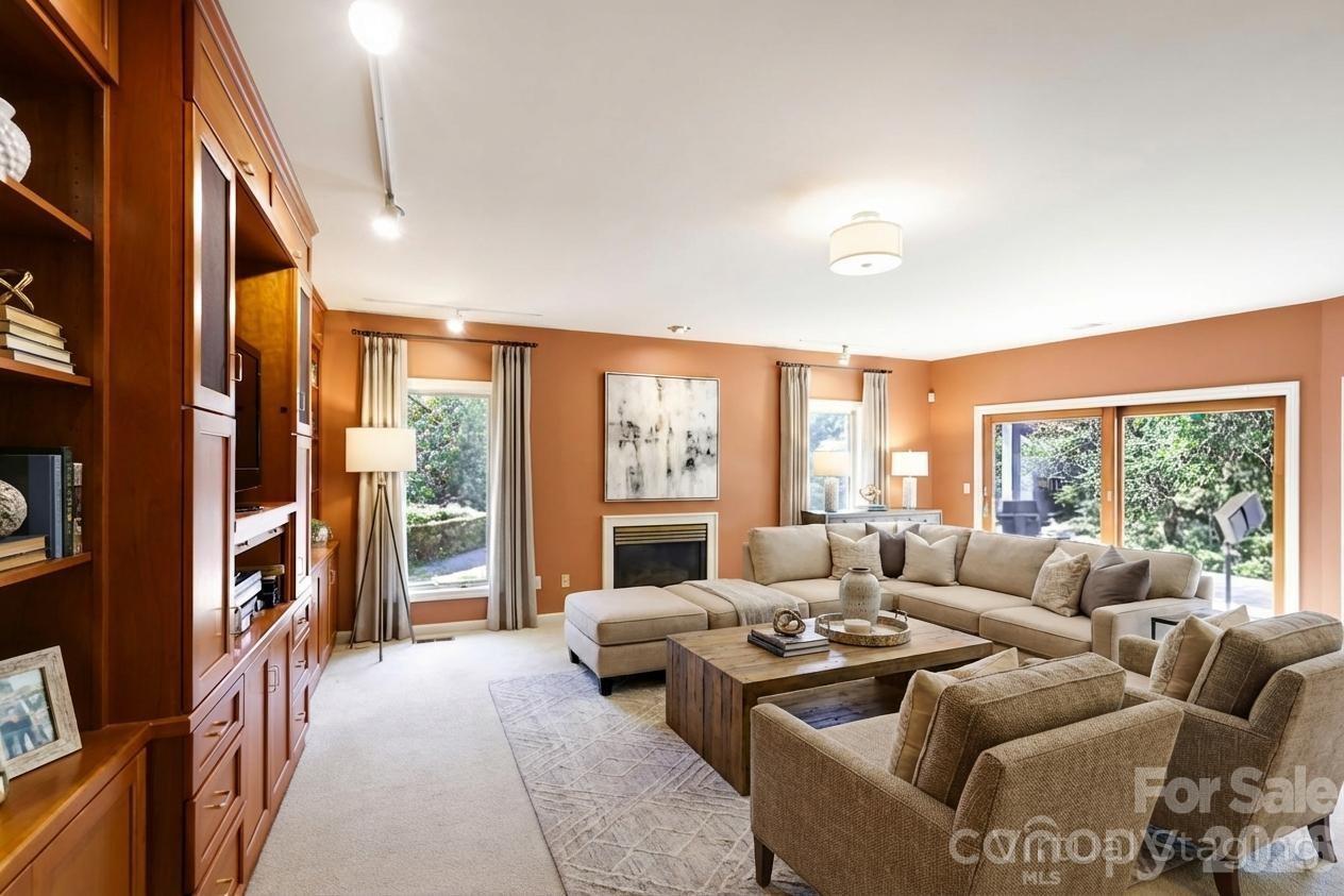 Lower level den virtually staged - 100 Elmridge Drive, Flat Rock