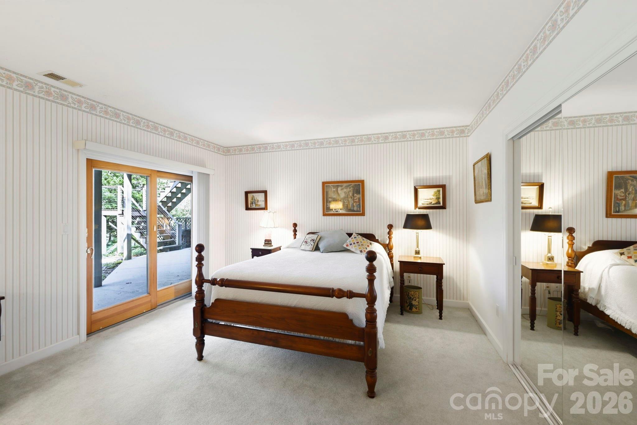 Third bedroom in lower level with access to back patio - 100 Elmridge Drive, Flat Rock