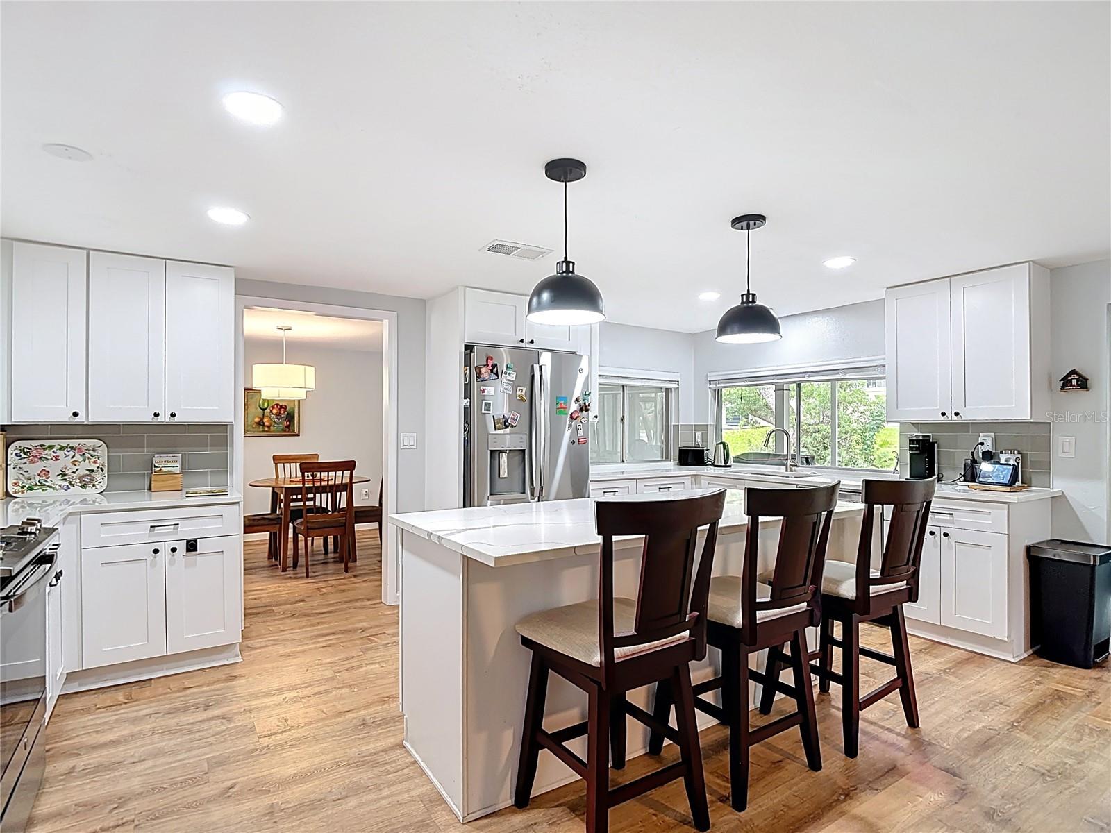 Wow, wow! Look at this dream kitchen! Island, lots of cabinets, quartz stone countertops! - 12709 CASTLEBERRY CT, HUDSON