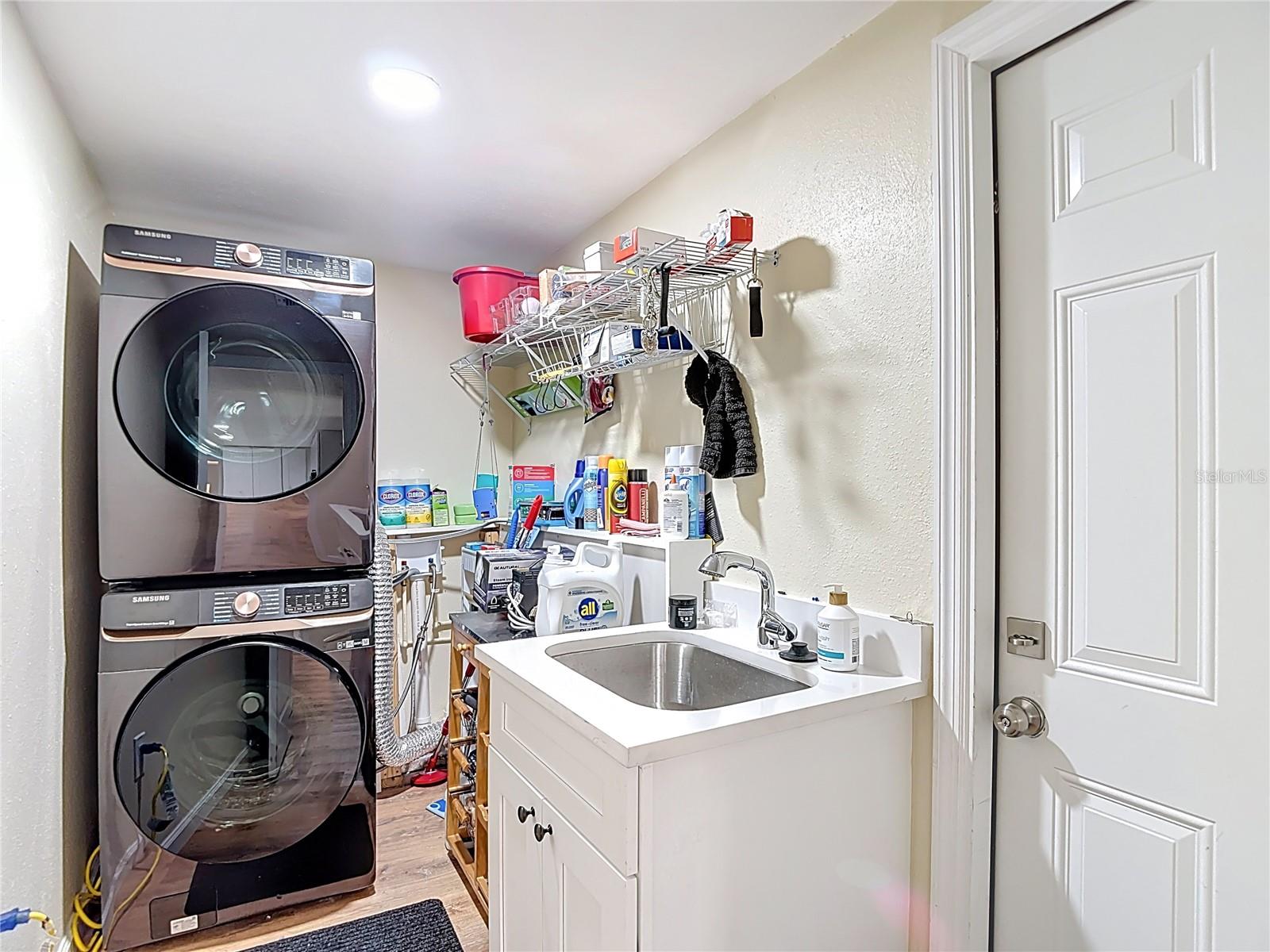 Inside laundry room with wash sink. - 12709 CASTLEBERRY CT, HUDSON