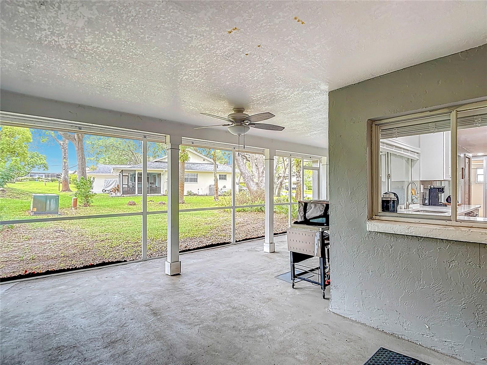 Pass thru windows from the kitchen for entertaining. - 12709 CASTLEBERRY CT, HUDSON