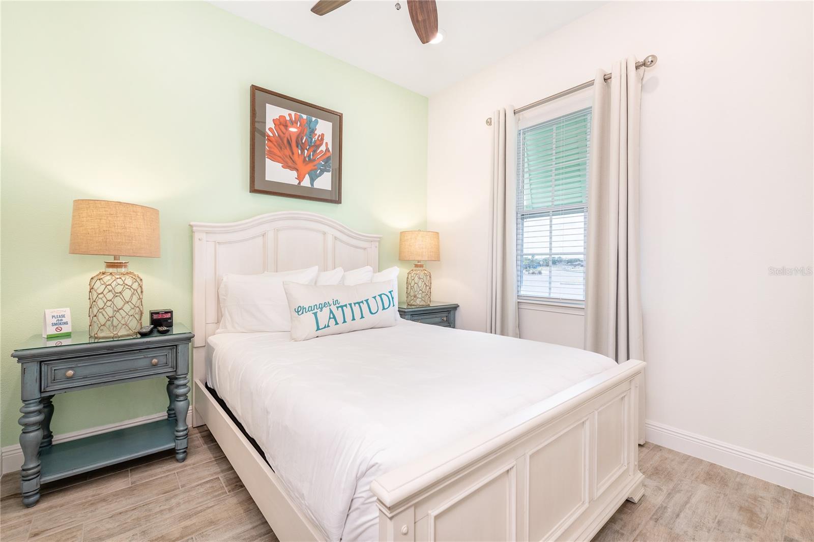 Bright guest bedroom with natural light located in Margaritaville Resort Orlando vacation home community - 8075 KNEE DEEP RD, KISSIMMEE