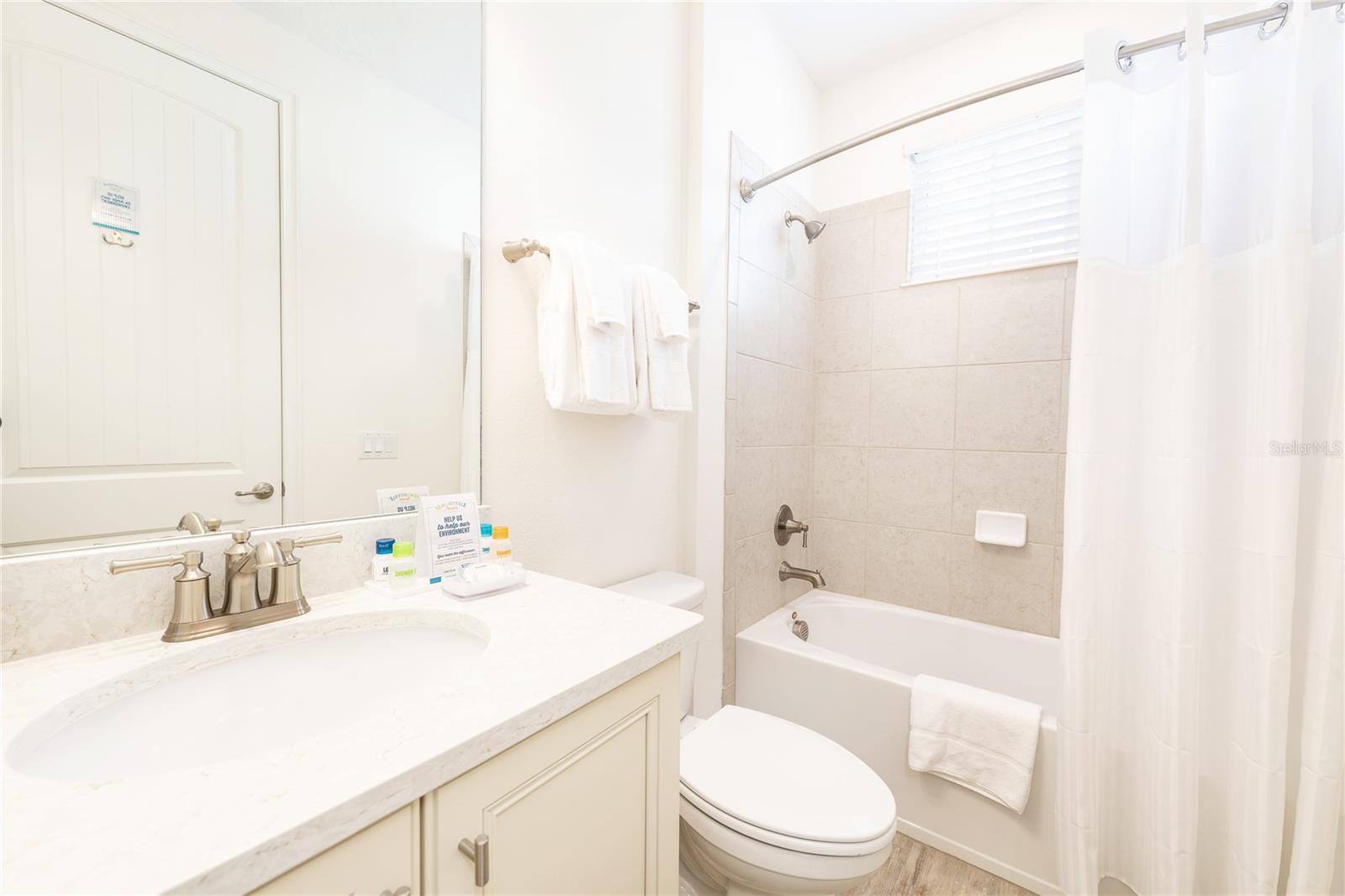 Full bathroom with clean finishes in Margaritaville Resort Orlando vacation home - 8075 KNEE DEEP RD, KISSIMMEE