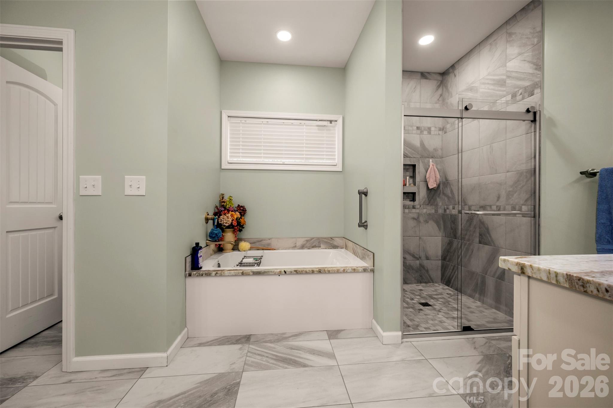 Well appointed ensuite bath with soothing colors, double vanities and gorgeous granite tops. - 88 Pounding Mill None, Hendersonville
