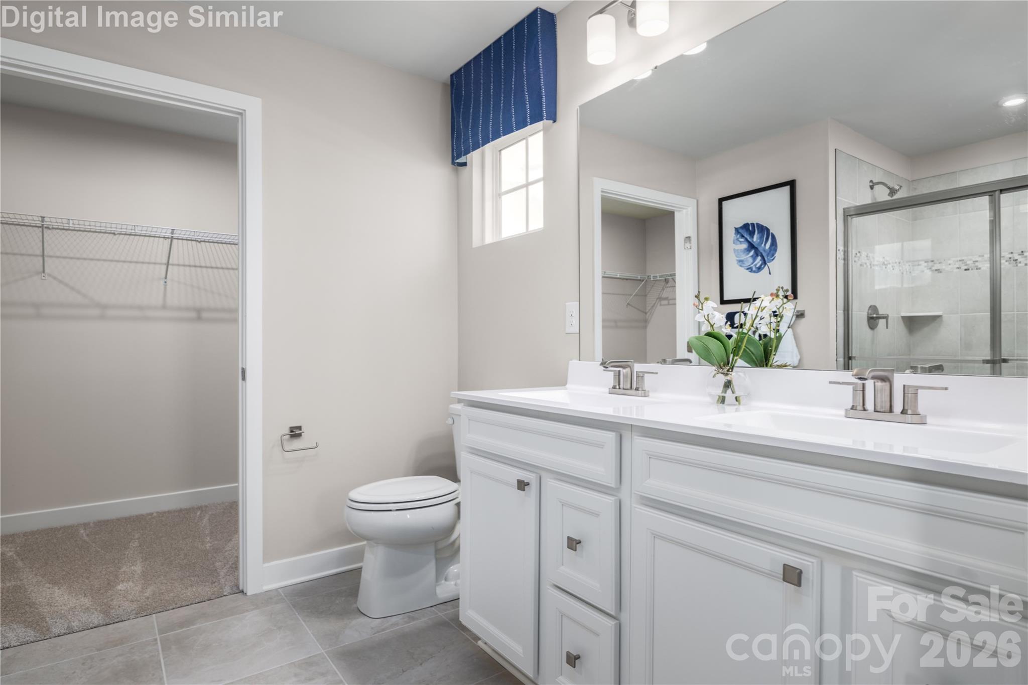 Style meets function: dual vanity flowing into your own walk-in closet. - 220 Linwood Estates Drive, Lexington