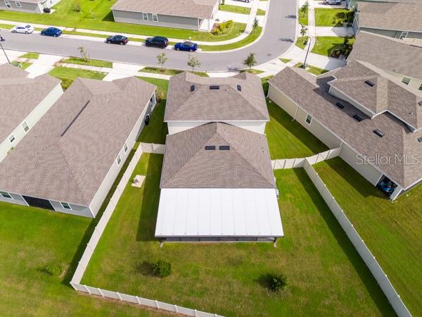 House from rear showing lanai (white) and rear yard (fenced) - 4382 FINCH LN, KISSIMMEE
