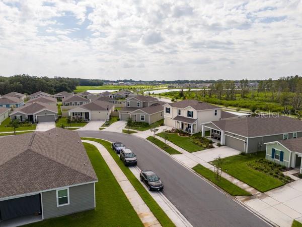 House in context with street - 4382 FINCH LN, KISSIMMEE