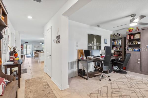 View from front door showing flex space and into living area - 4382 FINCH LN, KISSIMMEE