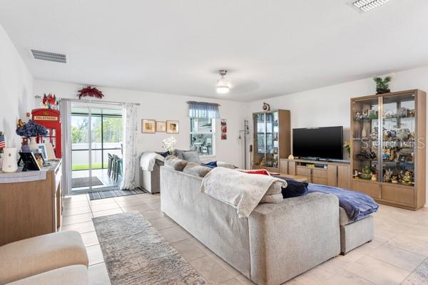 Living area showing current arrangement - 4382 FINCH LN, KISSIMMEE