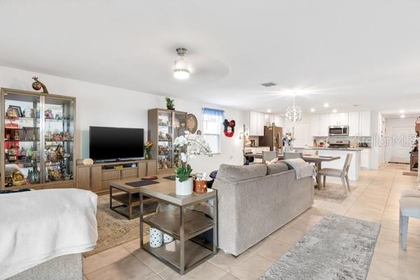Living, dining and kitchen areas from exit to lanai - 4382 FINCH LN, KISSIMMEE