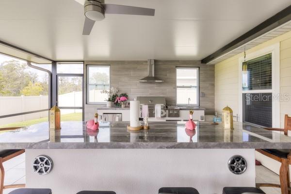 Dining and kitchen areas in lanai - 4382 FINCH LN, KISSIMMEE