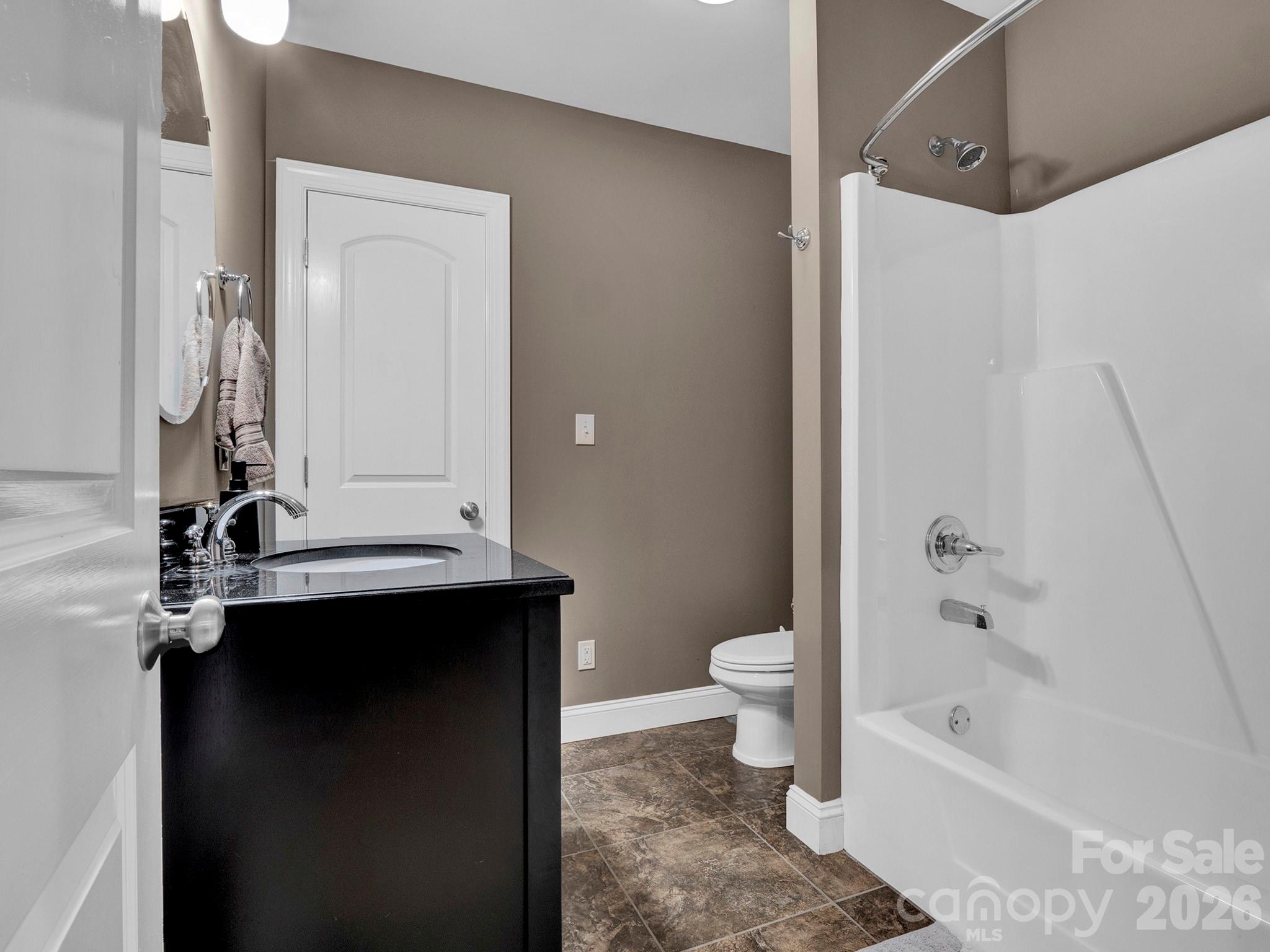 Full Bath lower level- opens into rec/main area and storage/flex space. - 2652 Bedford Place NW, Concord