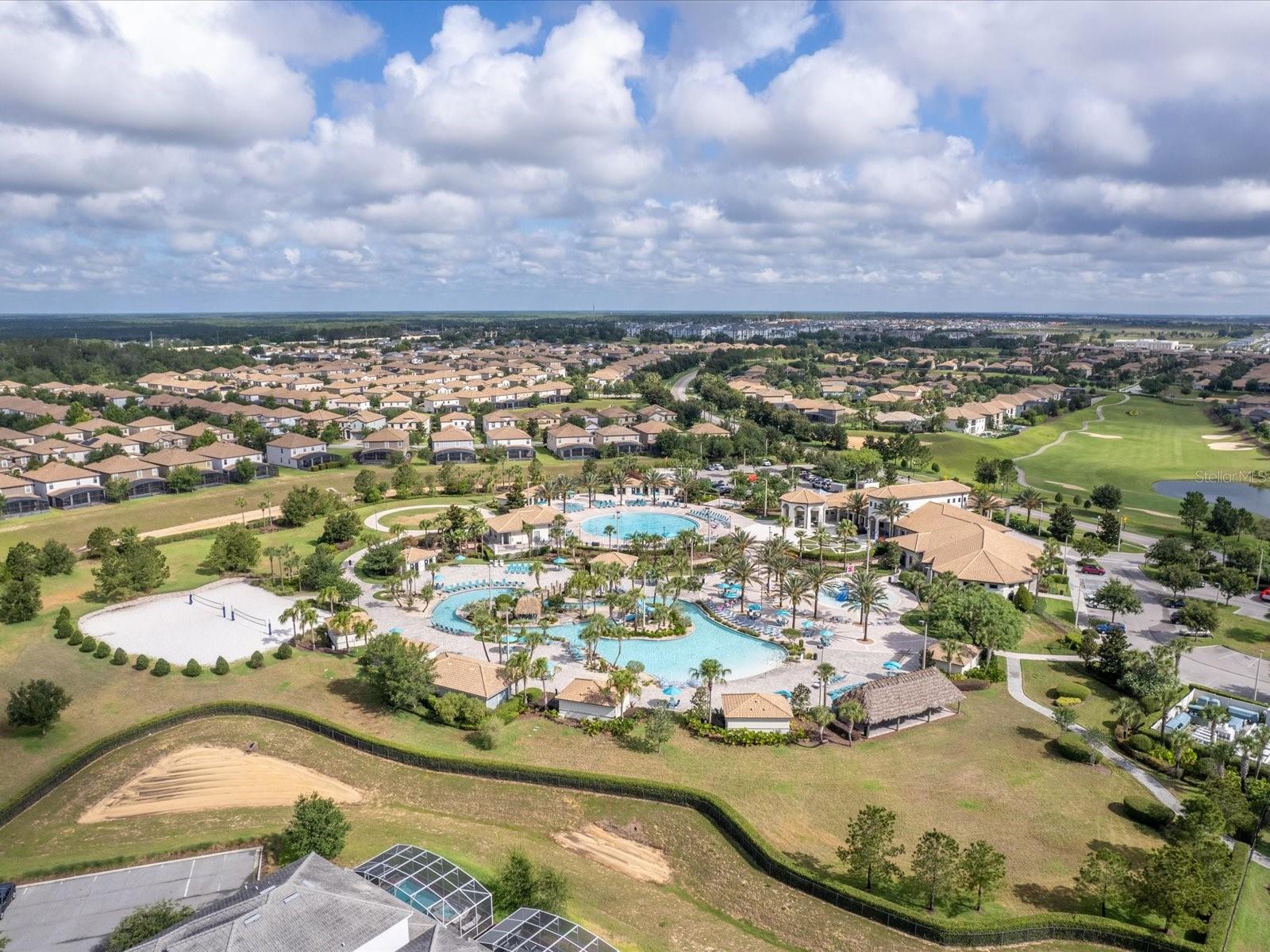 The Oasis Clubhouse, pool, lazy river, kids splash pad, and beach volleyball - 1300 GLENEAGLES LN, DAVENPORT