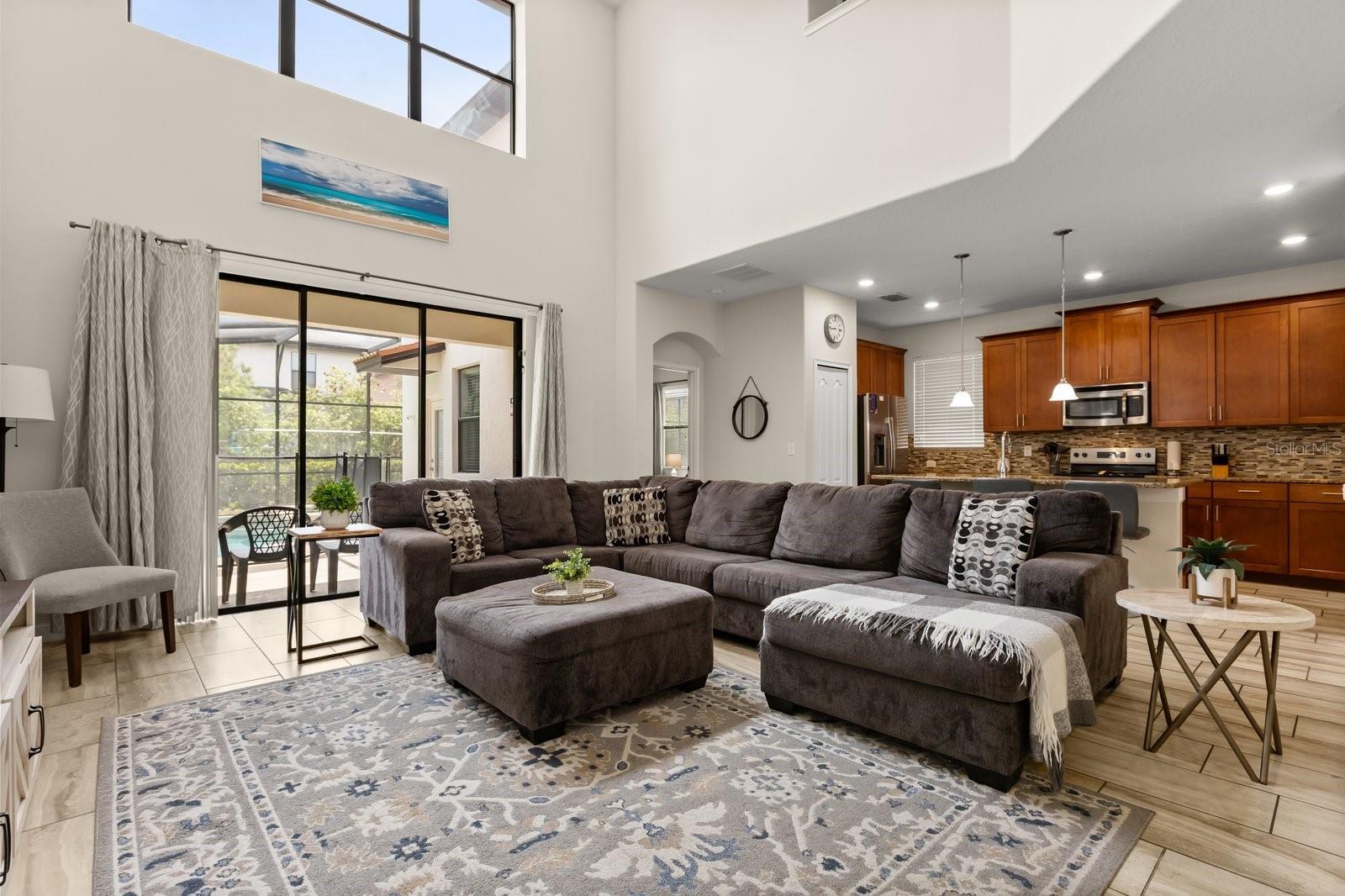 Living Room with Cathedral Ceilings - 5493 SOLTERRA CIR, DAVENPORT