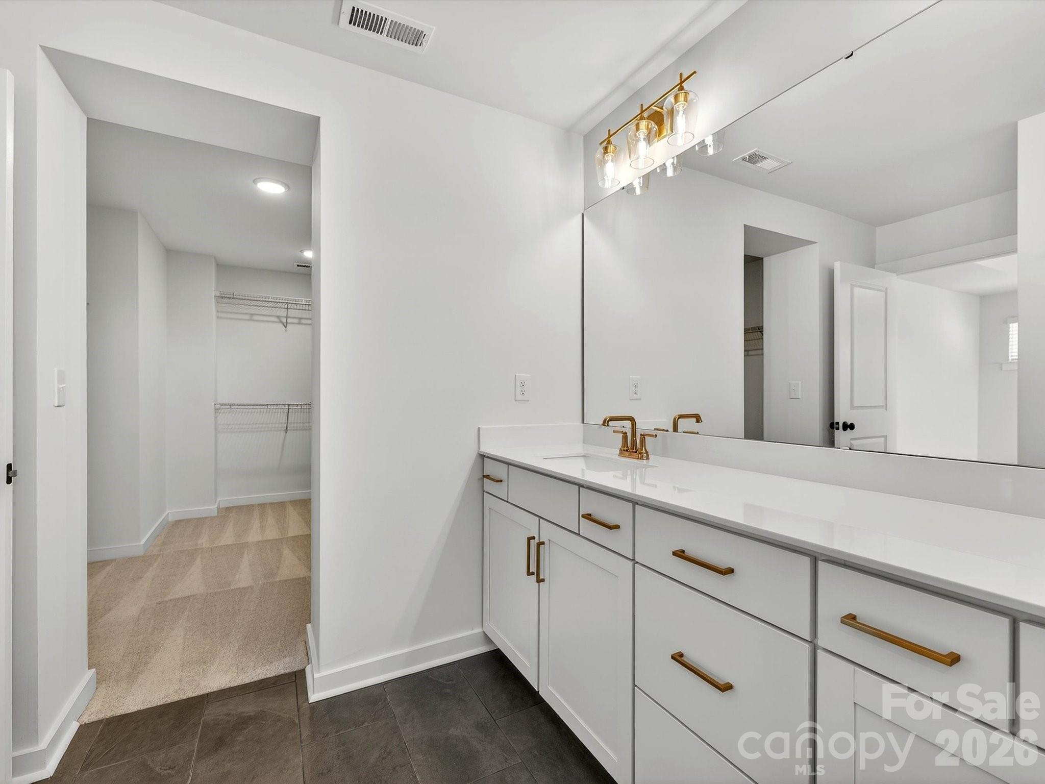 Primary bathroom and primary bathroom- dual vanity features soft close doors & drawers - 202 Quartz Hill Way, Waxhaw