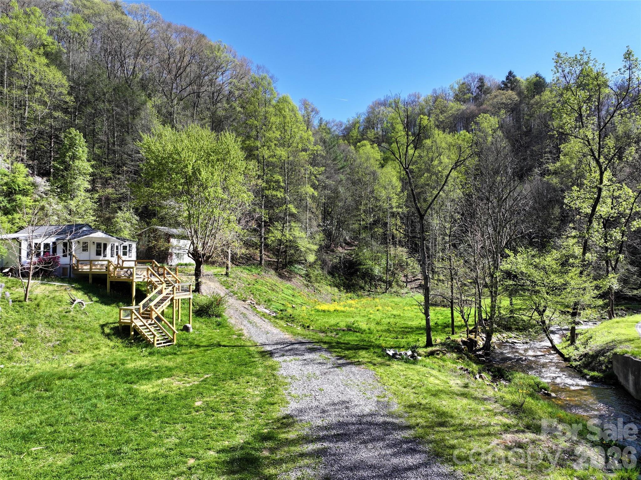 Farmhouse with new deck overlooking Pigeon Roost Creek - 2180 Pigeon Roost Road, Green Mountain