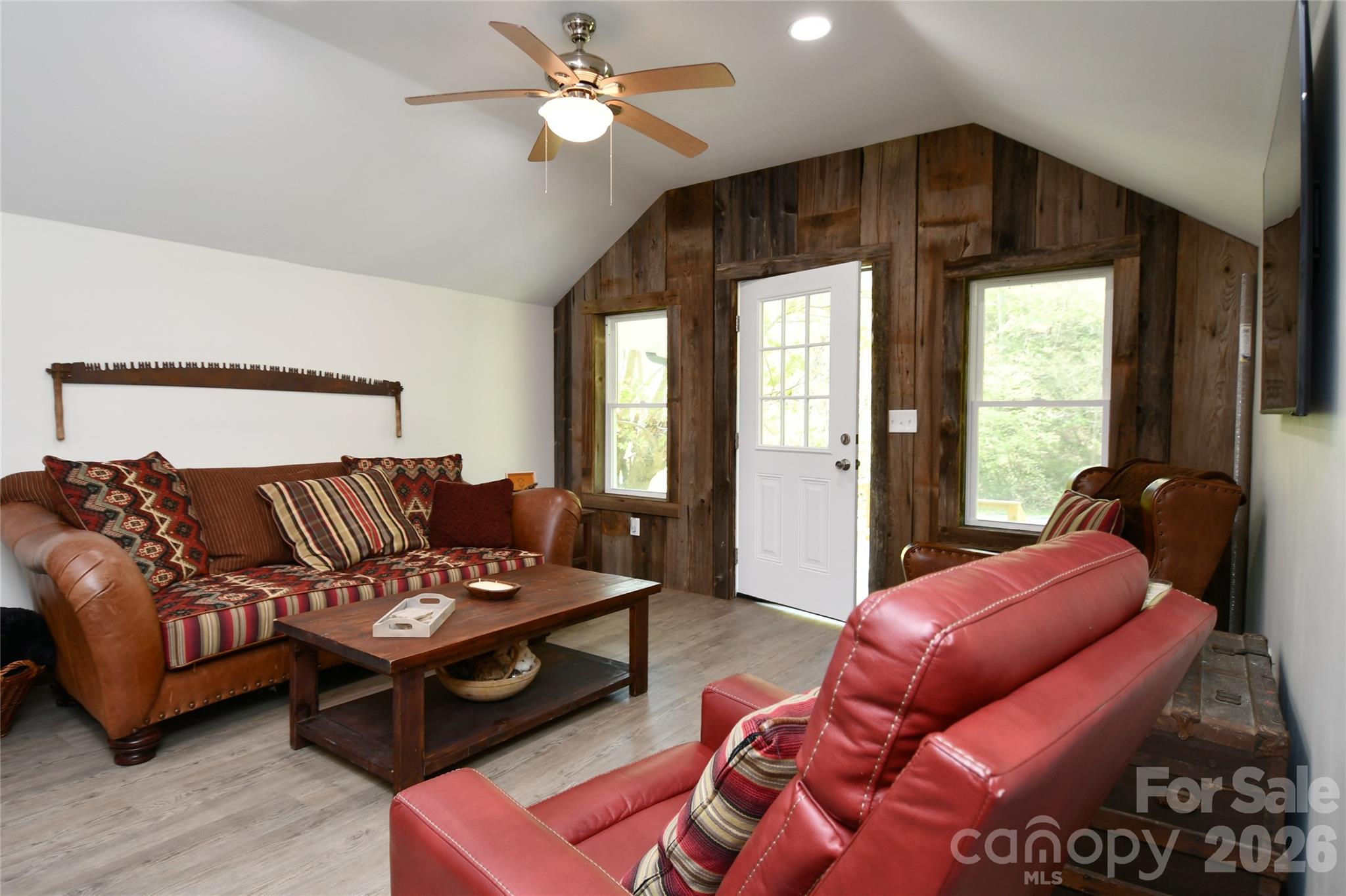 Living Room utilizes gorgeous weathered barnwood from property - 2180 Pigeon Roost Road, Green Mountain