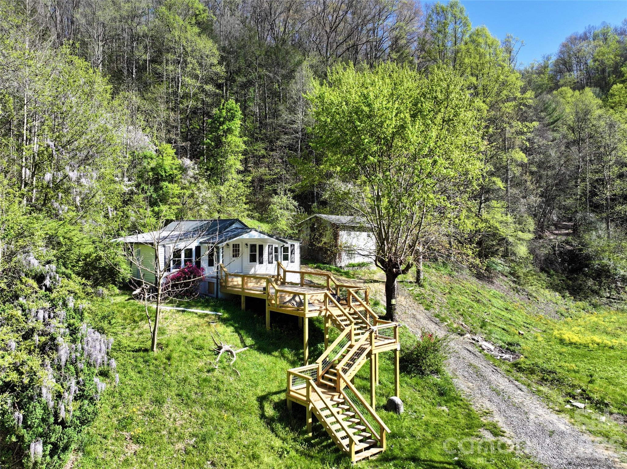Aerial view of remodeled farmhouse and new deck - 2180 Pigeon Roost Road, Green Mountain