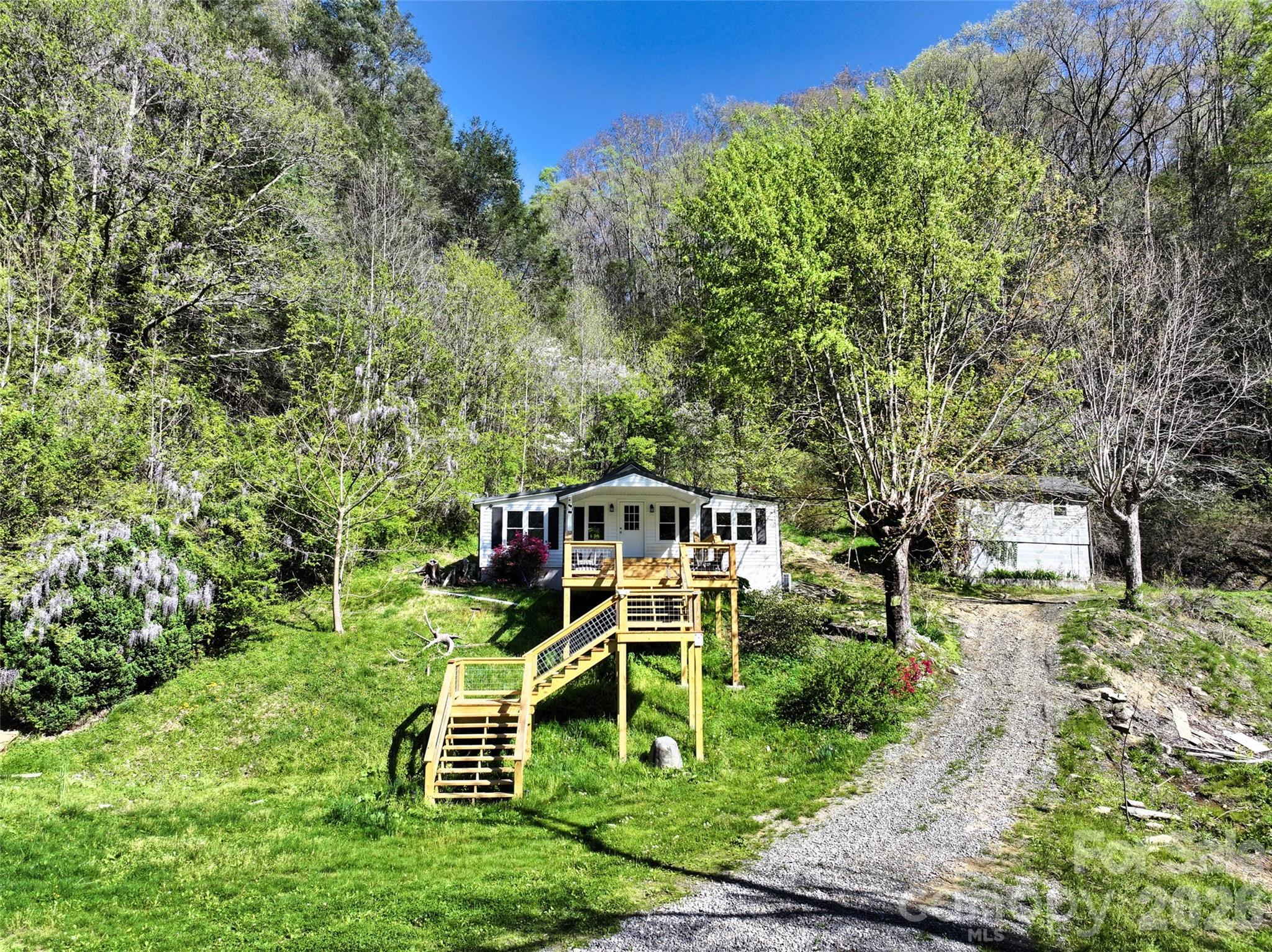 Walk up the deck stairs or drive up to the door level - 2180 Pigeon Roost Road, Green Mountain