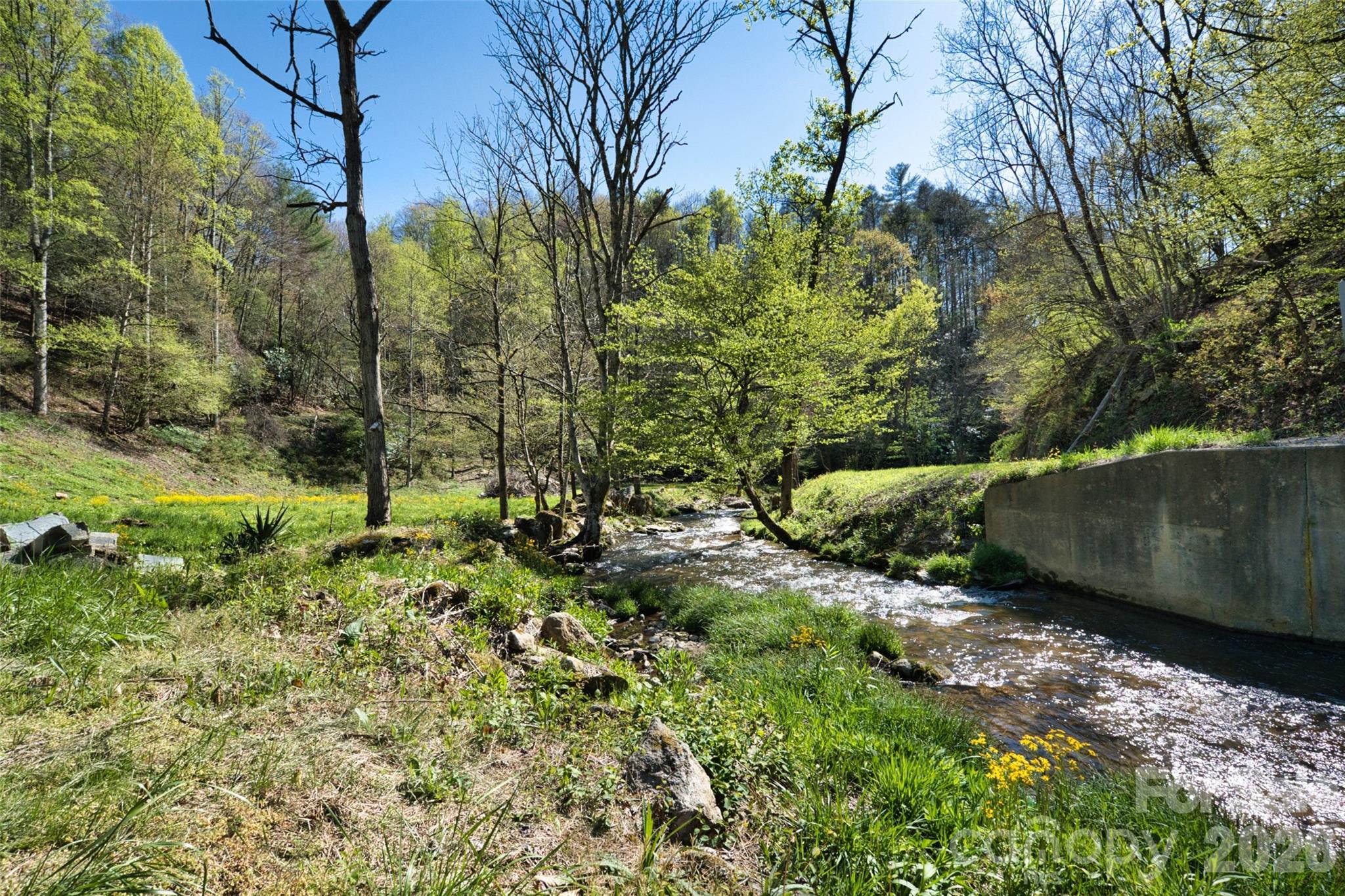 Bold, cheerful Pigeon Roost Creek at the farmhouse - 2180 Pigeon Roost Road, Green Mountain