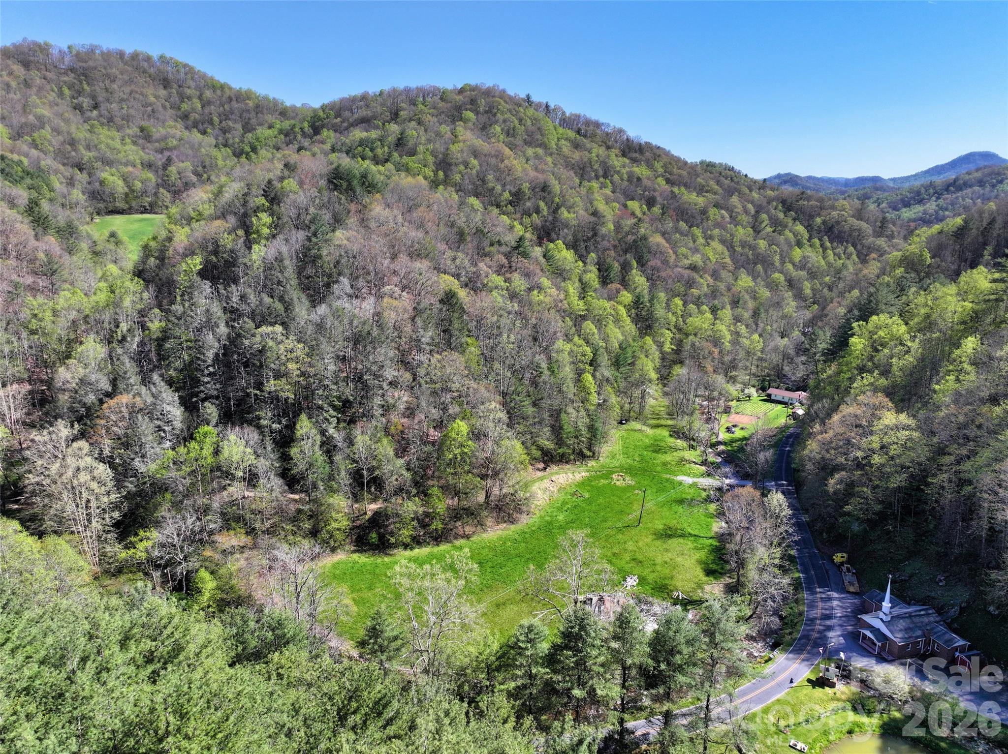 Another flat pasture with fertile soil, bordered by Pigeon Roost Creek - 2180 Pigeon Roost Road, Green Mountain