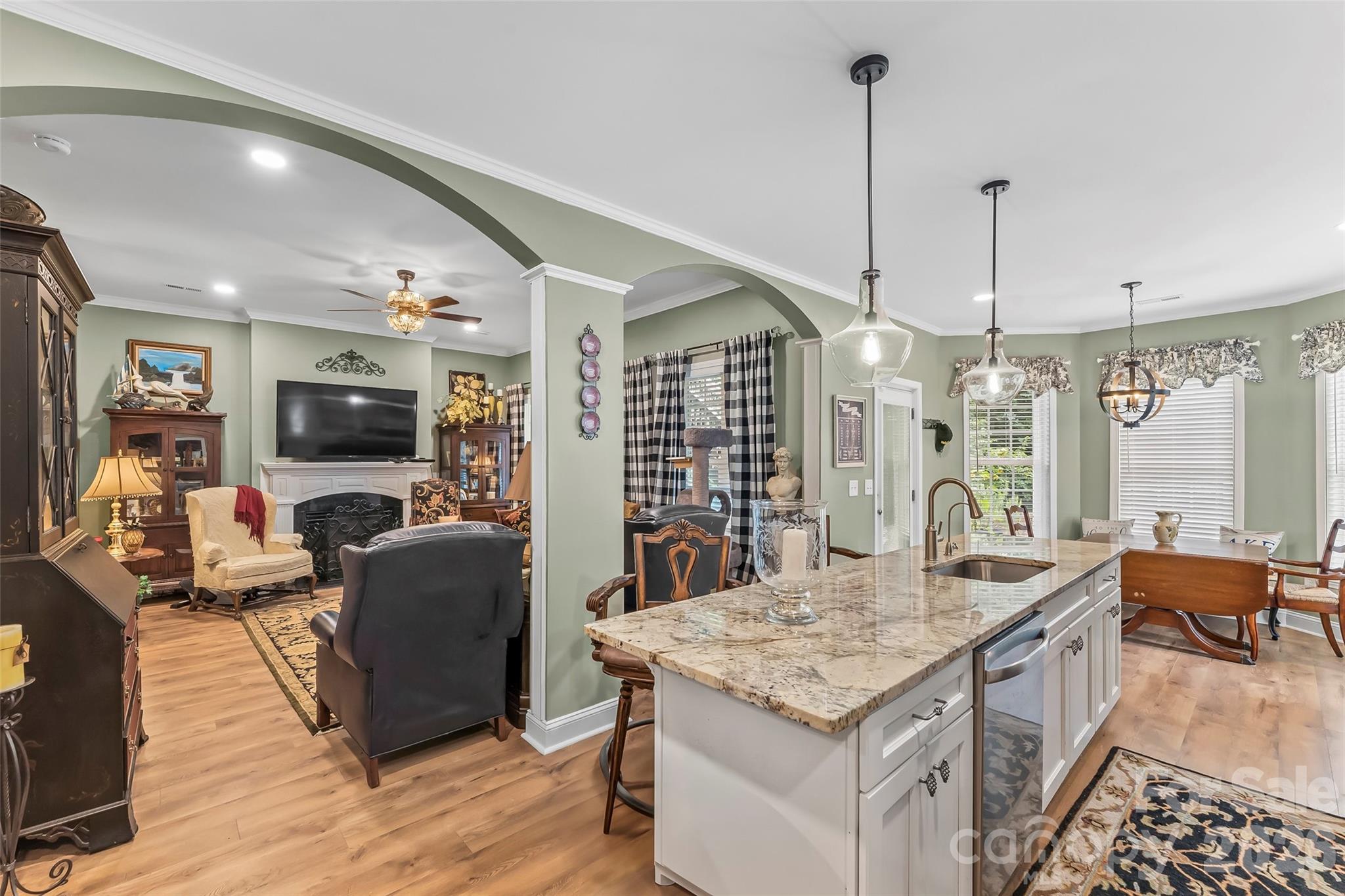 Beautiful arches, high ceilings and crown molding complete this lovely space. - 120 Harrison Point Court, Mooresville