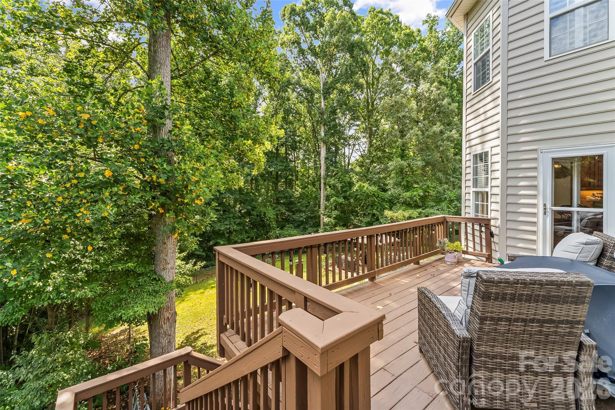 This is the backyard you've been waiting for - tree-lined, usable, and peaceful. - 120 Harrison Point Court, Mooresville