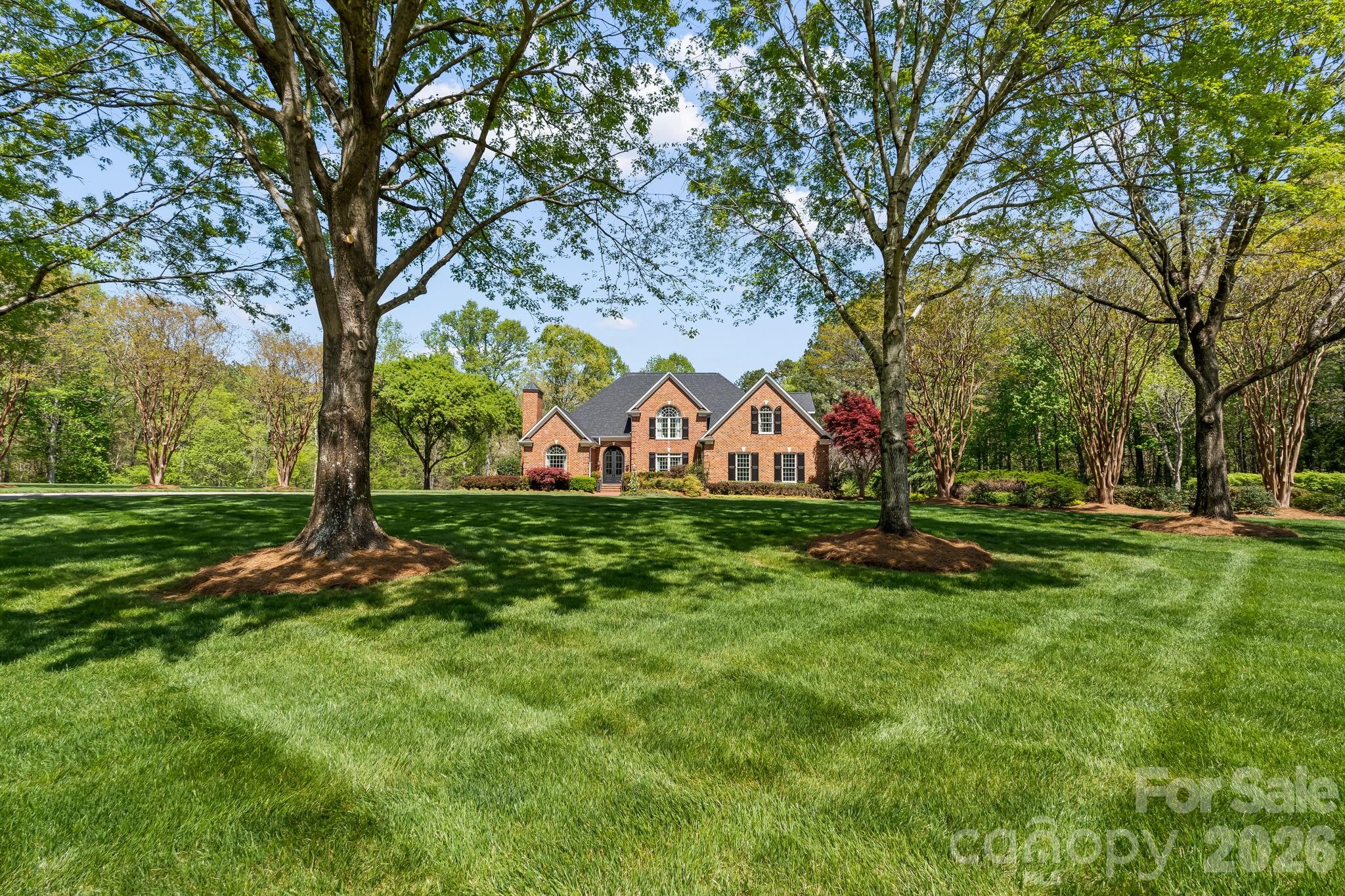 Professionally designed landscaping with irrigation system in place - 11555 Double Spring Road, Lewisville