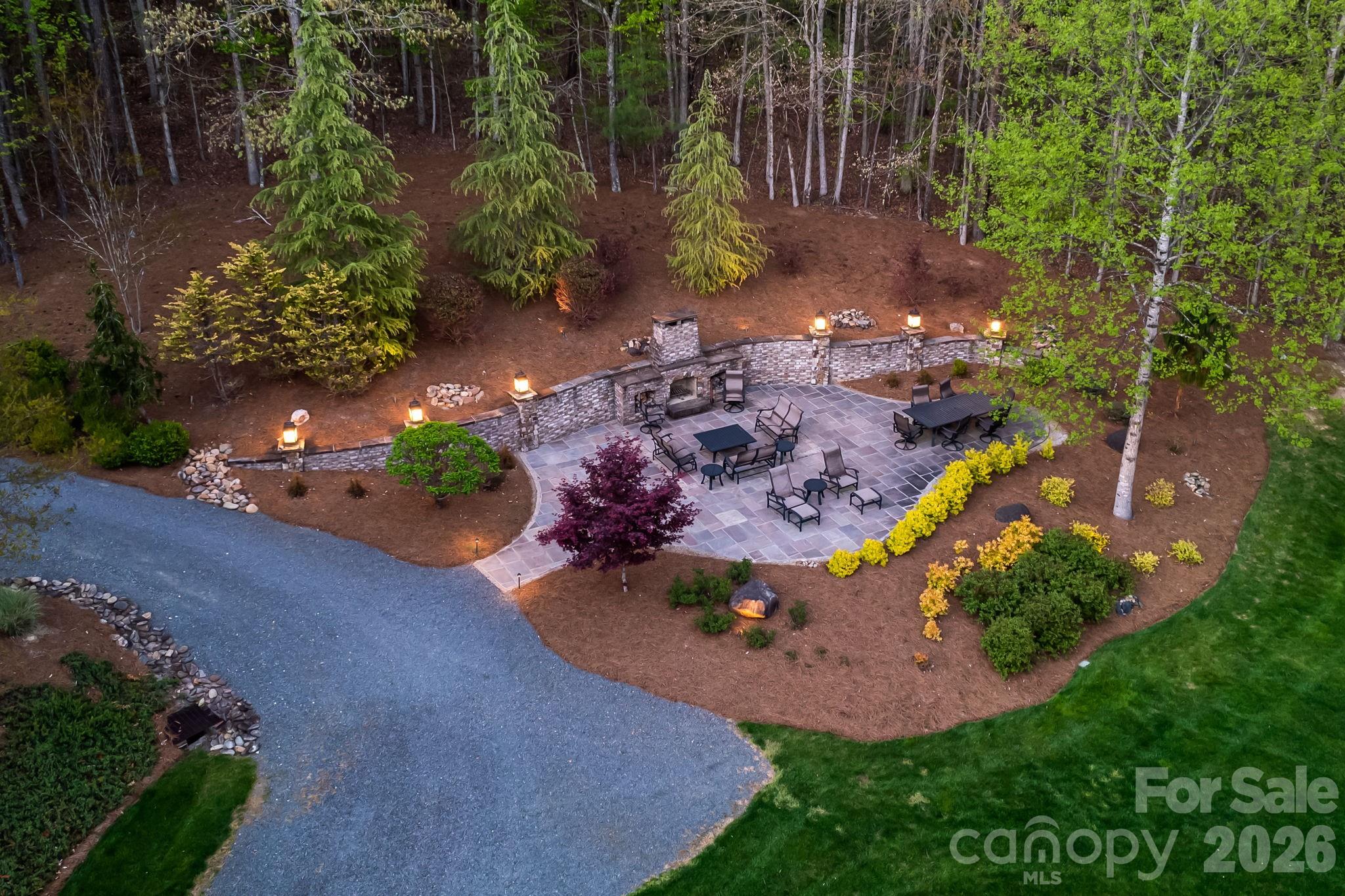 Enjoy the outdoor fireplace with evening fires and lovely landscaping - 11555 Double Spring Road, Lewisville