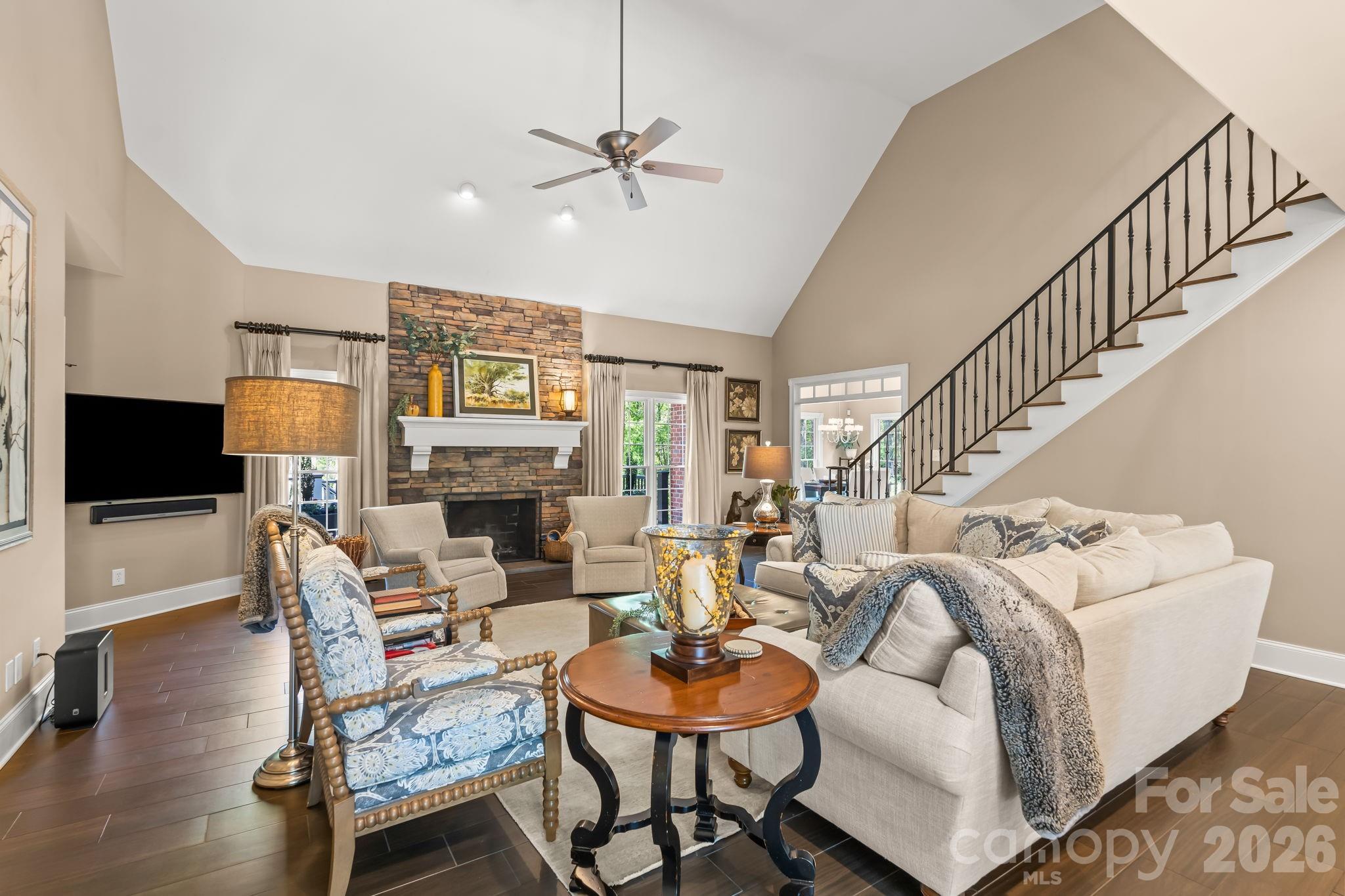 Vaulted ceilings, stone fireplace with gas logs, and custom staircase built in 2014 - 11555 Double Spring Road, Lewisville