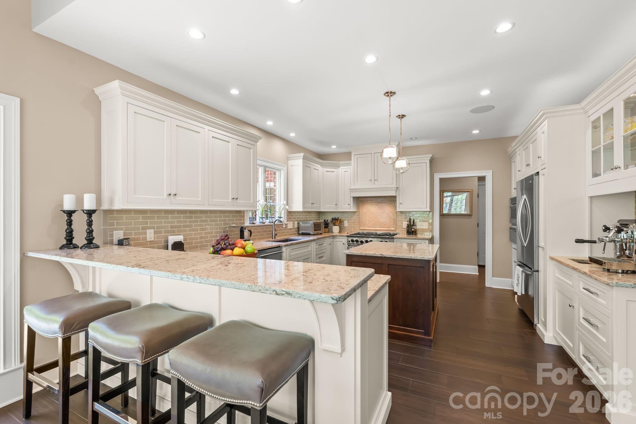 Chefs kitchen with 6 burner gas range and double oven - 11555 Double Spring Road, Lewisville