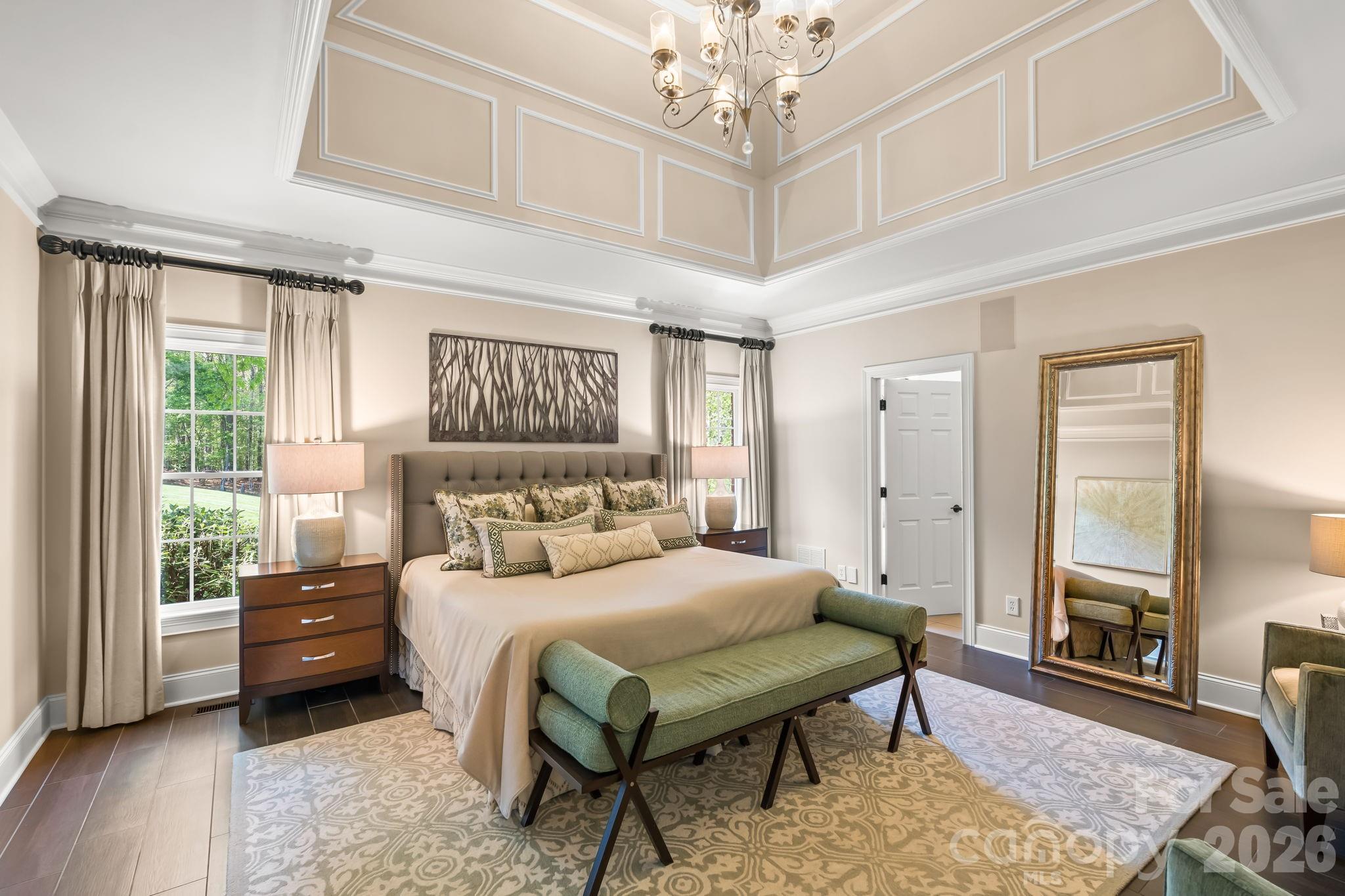 Spacious primary retreat with tray ceiling and chandelier - 11555 Double Spring Road, Lewisville
