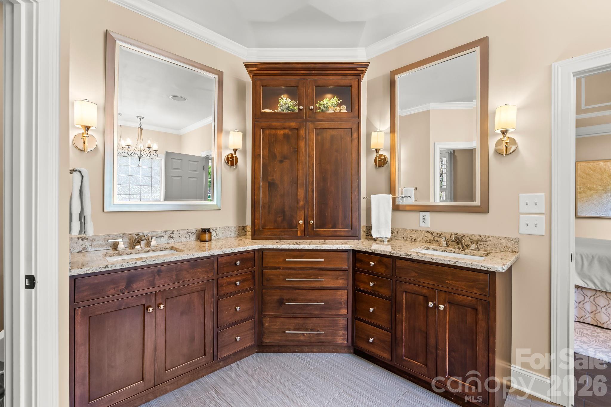 Custom cabinets with quartz countertops and dual vanities.Custom cabinets with quartz countertops and dual vanities. - 11555 Double Spring Road, Lewisville