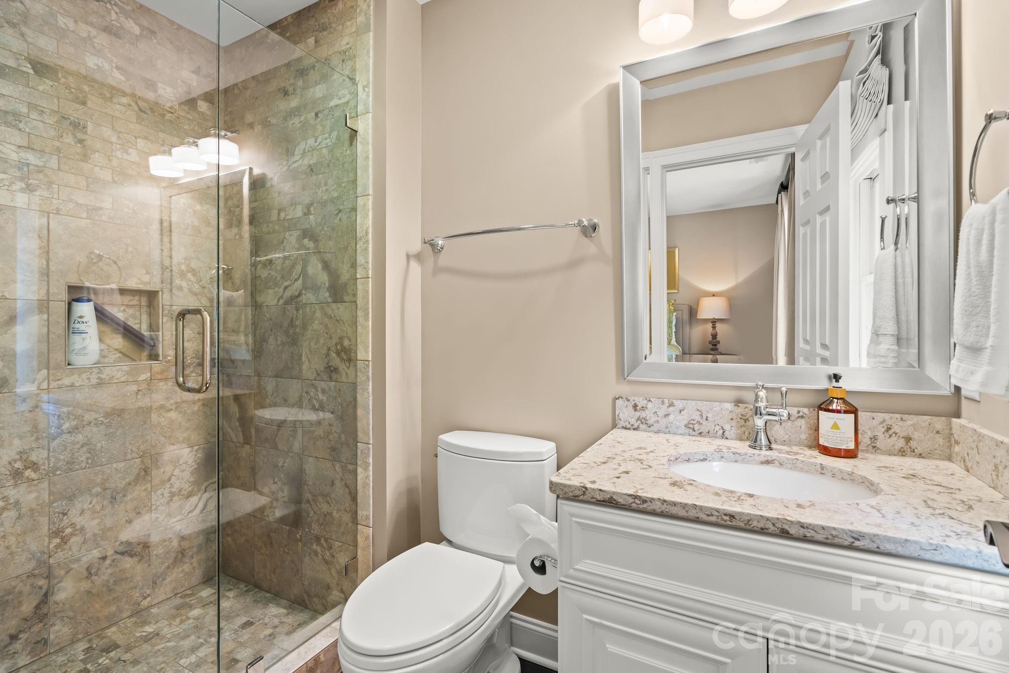 Lovely en suite bathroom with walk in tiled shower - 11555 Double Spring Road, Lewisville
