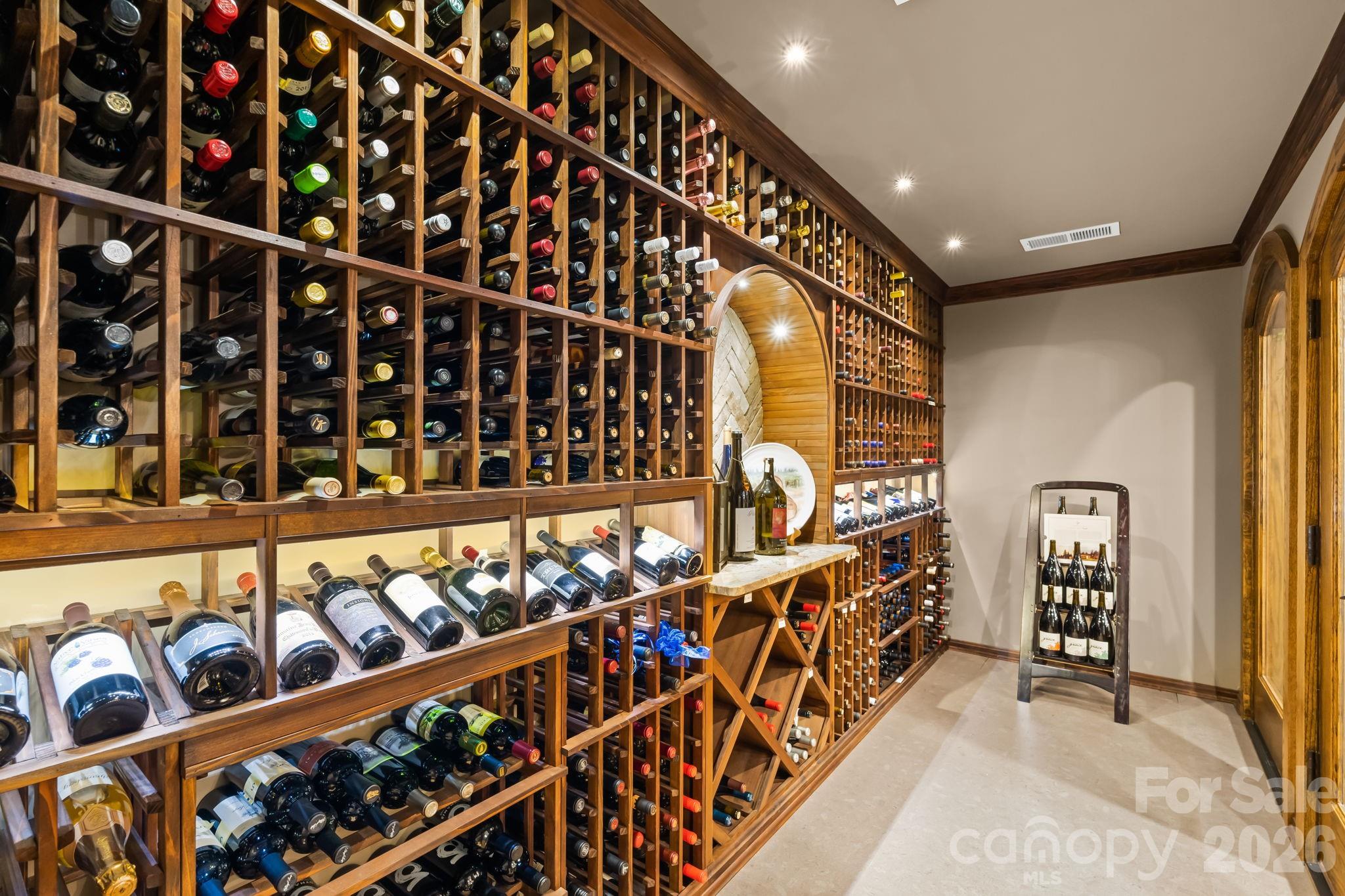Humidity controlled wine cellar boasts cork floors and houses 775 bottles. - 11555 Double Spring Road, Lewisville